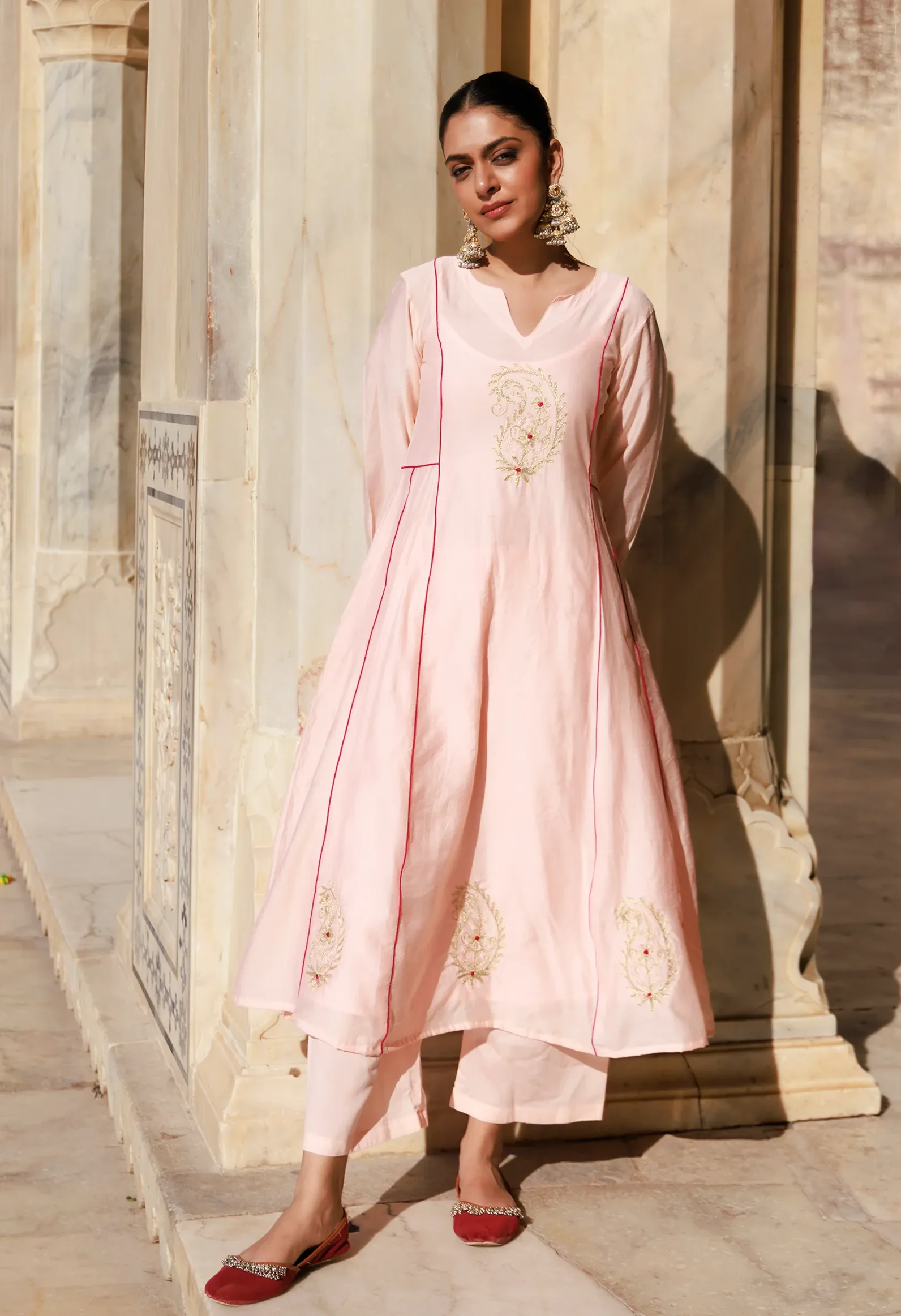 Peach Chanderi kurta set with delicate aari embroidery and fluid silhouette from Golden Muslin by Priyanka Rathore
