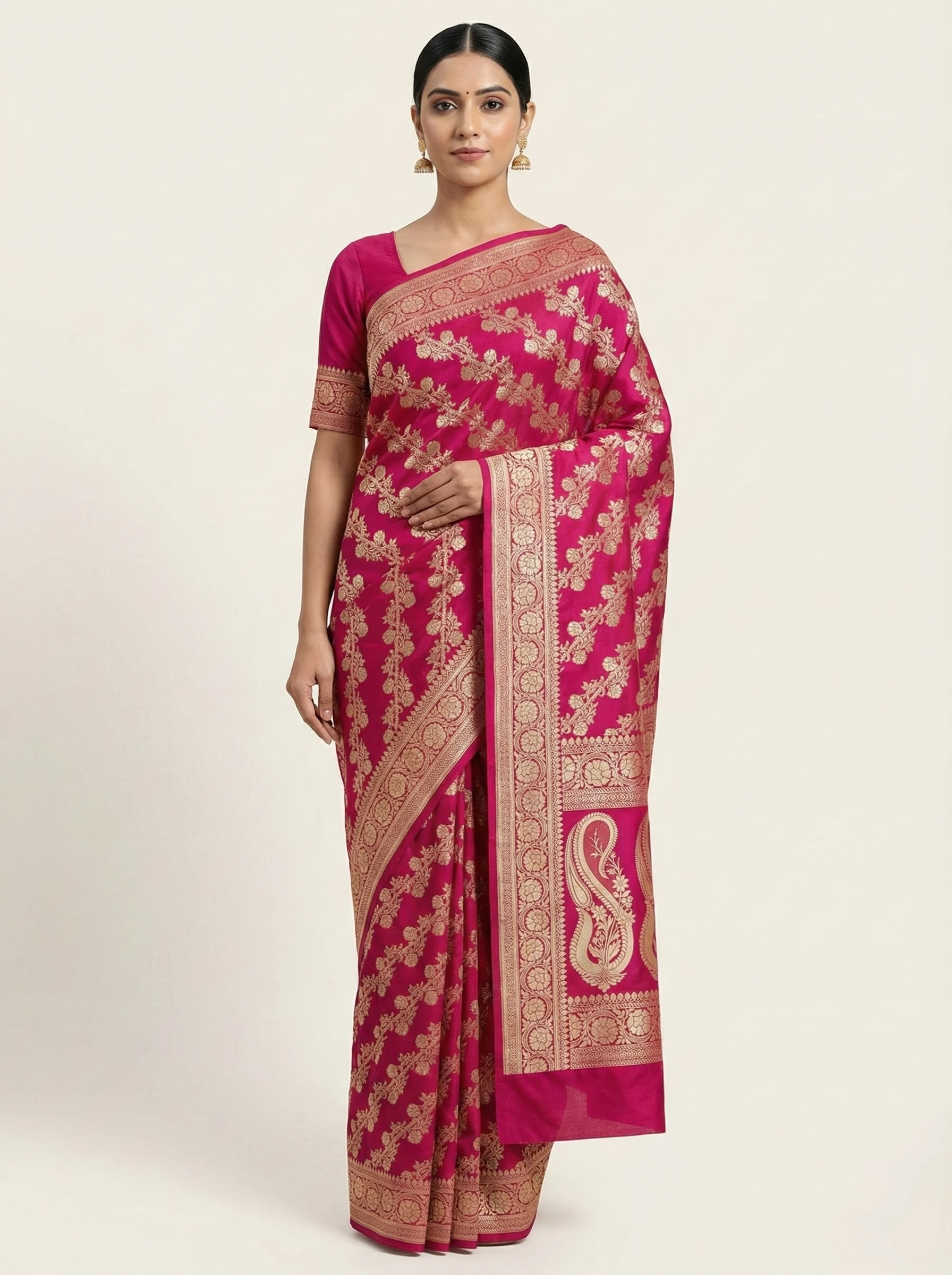 Rani pink Banarasi silk saree with golden zari bootis and paisley pallu from Golden Muslin By Naaritva Banaras