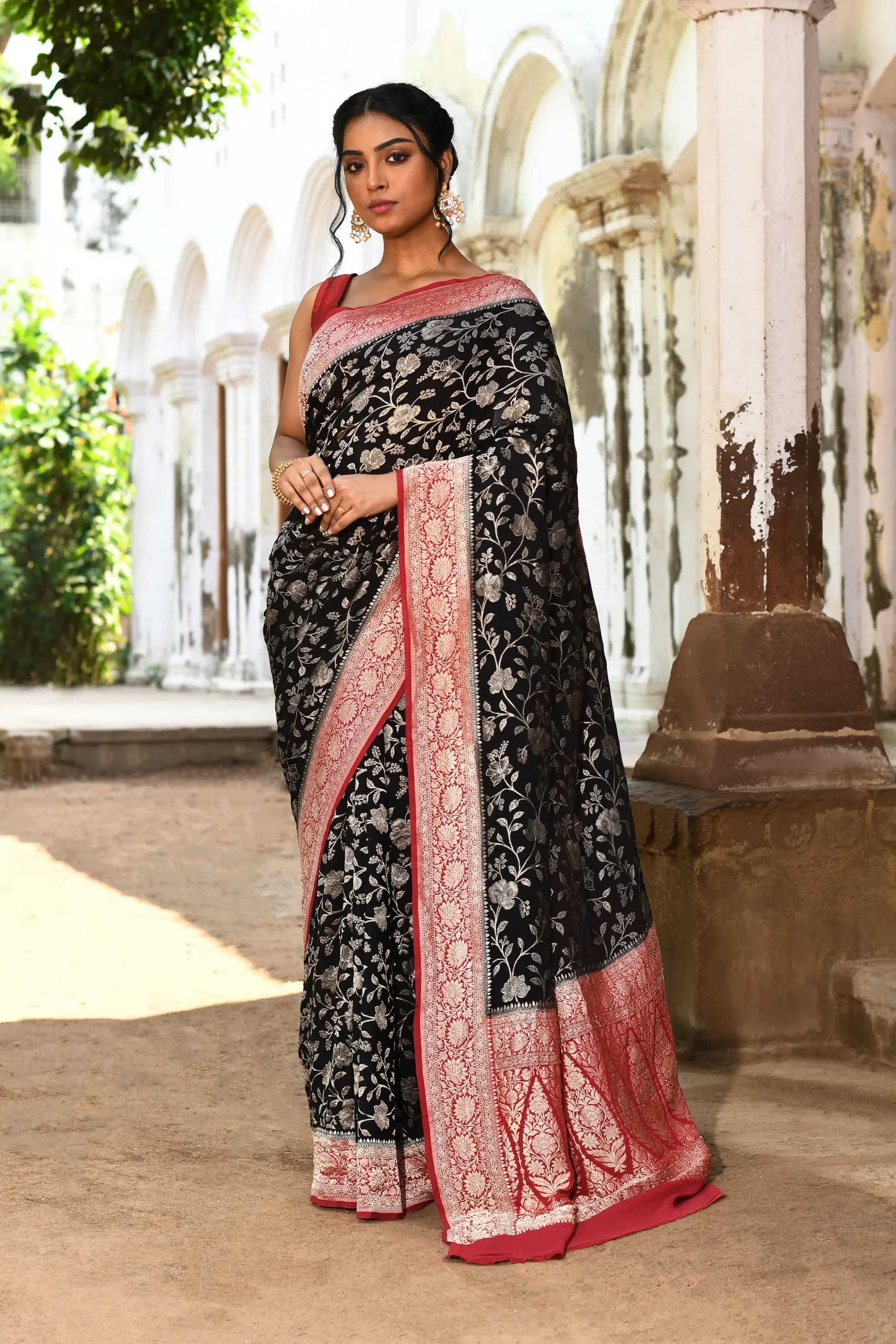 Black Banarasi silk saree with gold zari flower jaal and contrast brown border from Golden Muslin By Naaritva Banaras