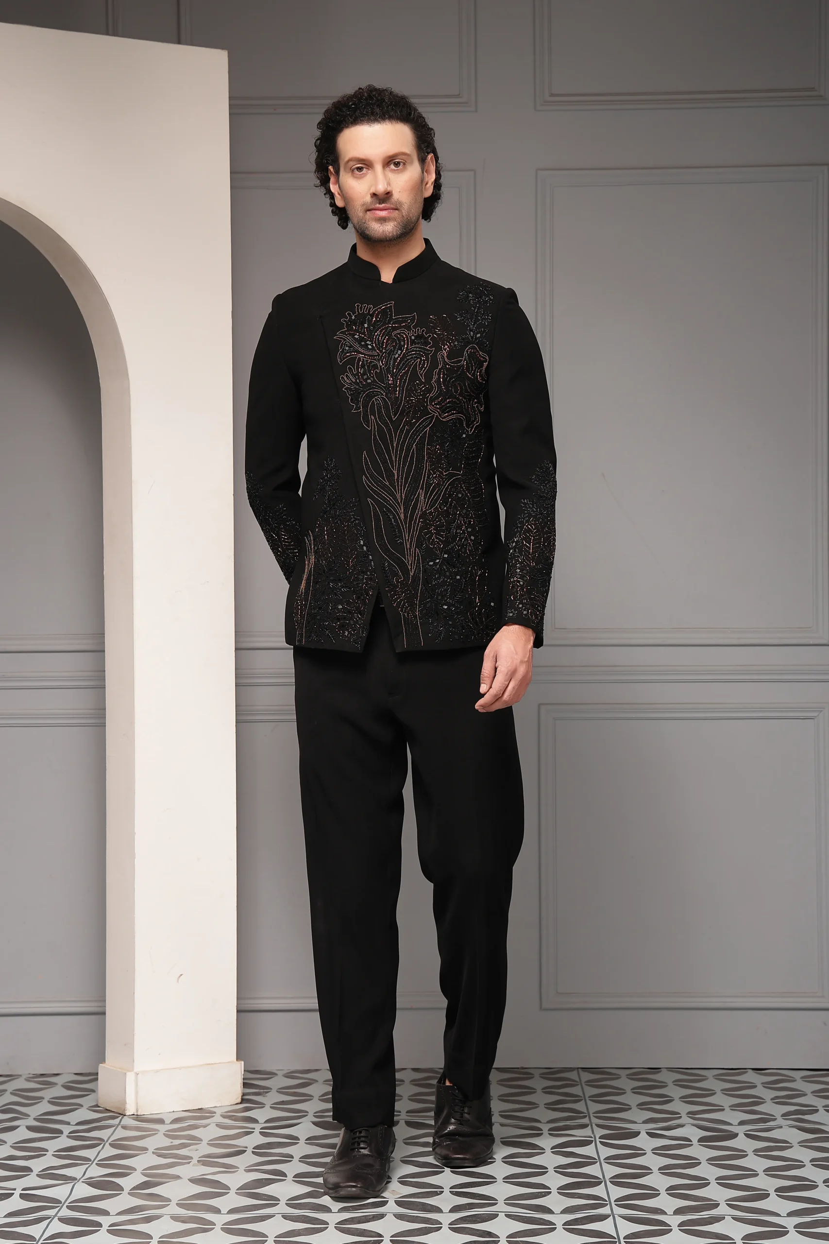 Refined black bandhgala set with metallic floral embroidery from Golden Muslin By Soniya G