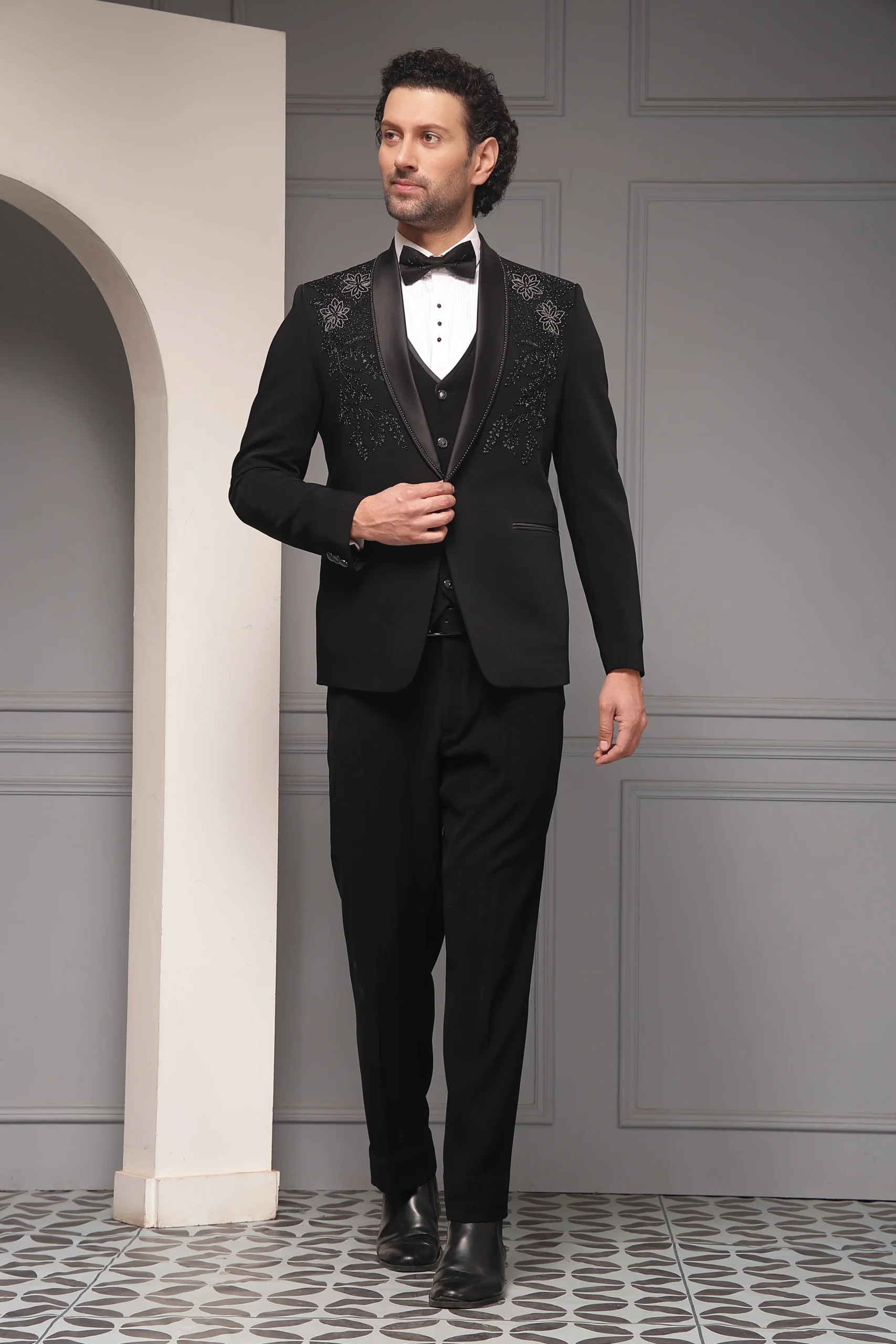 Black embroidered tuxedo set with satin shawl lapel from Golden Muslin By Soniya G