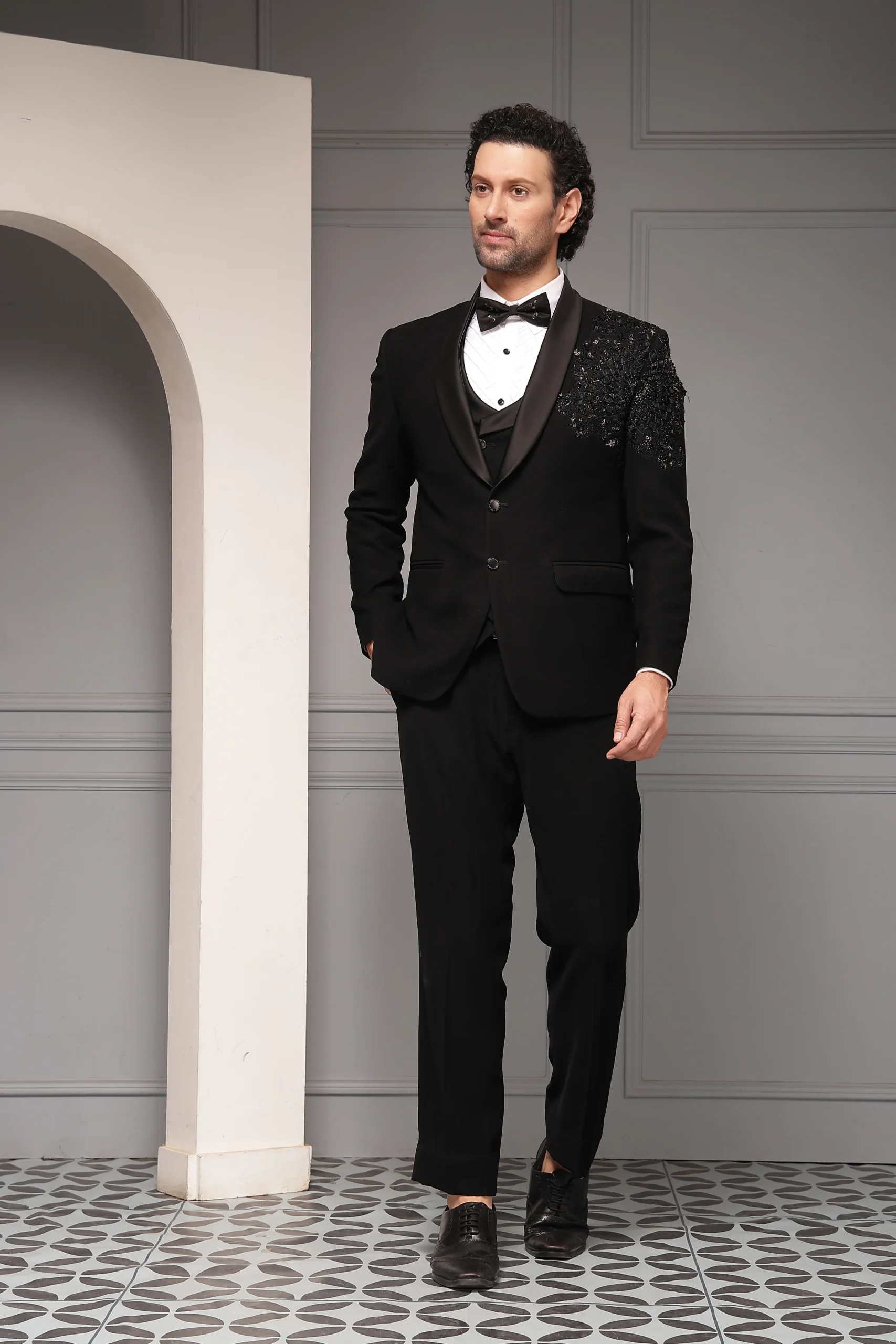 Black tuxedo set with tonal embellished shawl lapel from Golden Muslin By Soniya G