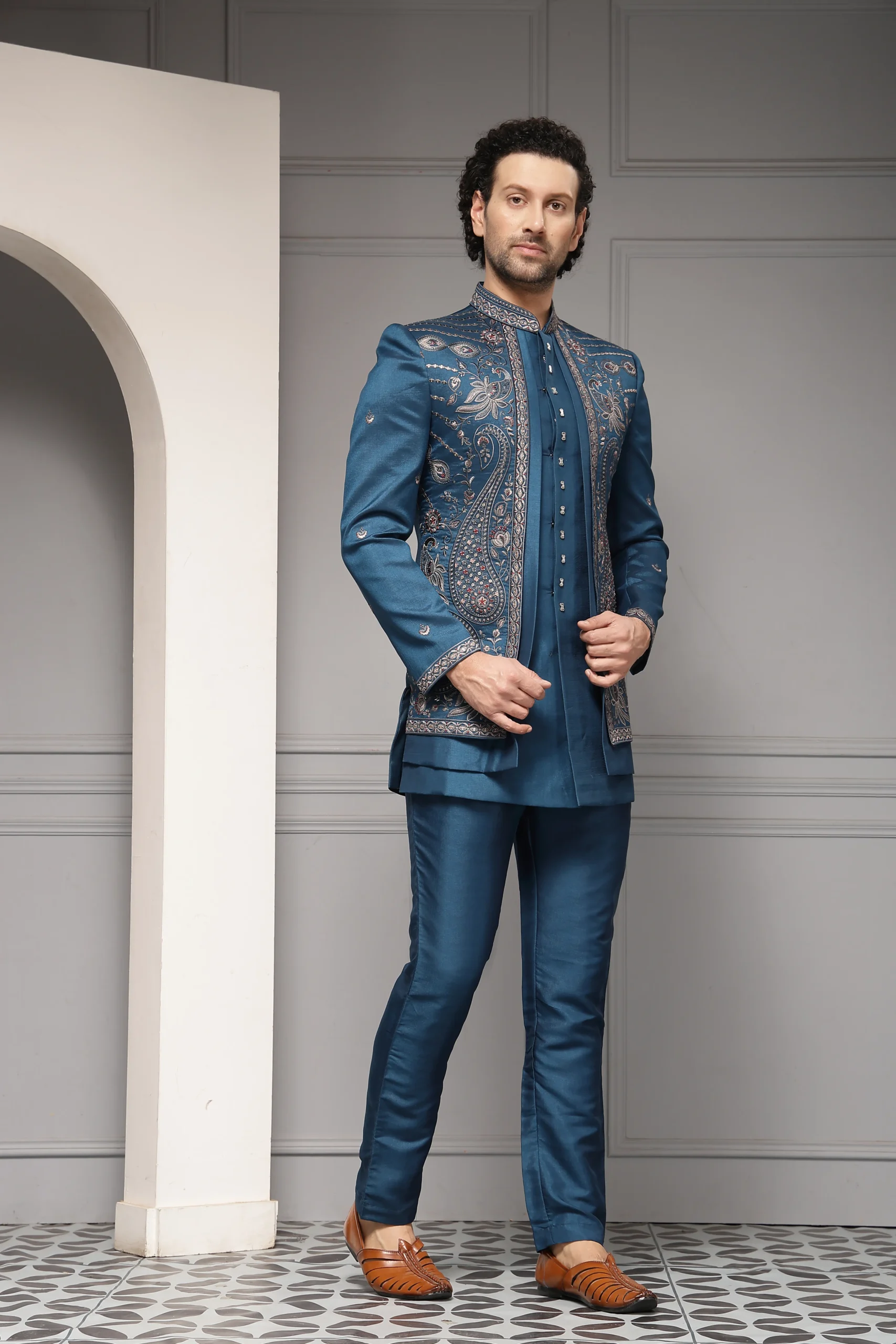 Teal blue embroidered bandhgala jacket with tailored trousers from Golden Muslin By Soniya G