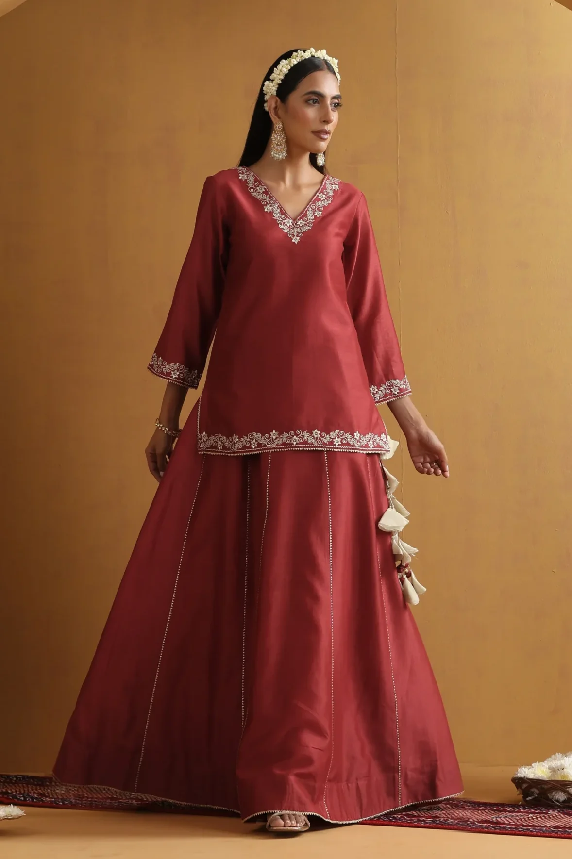 Rust embroidered lehenga set with silver floral detailing from Golden Muslin By Suikala
