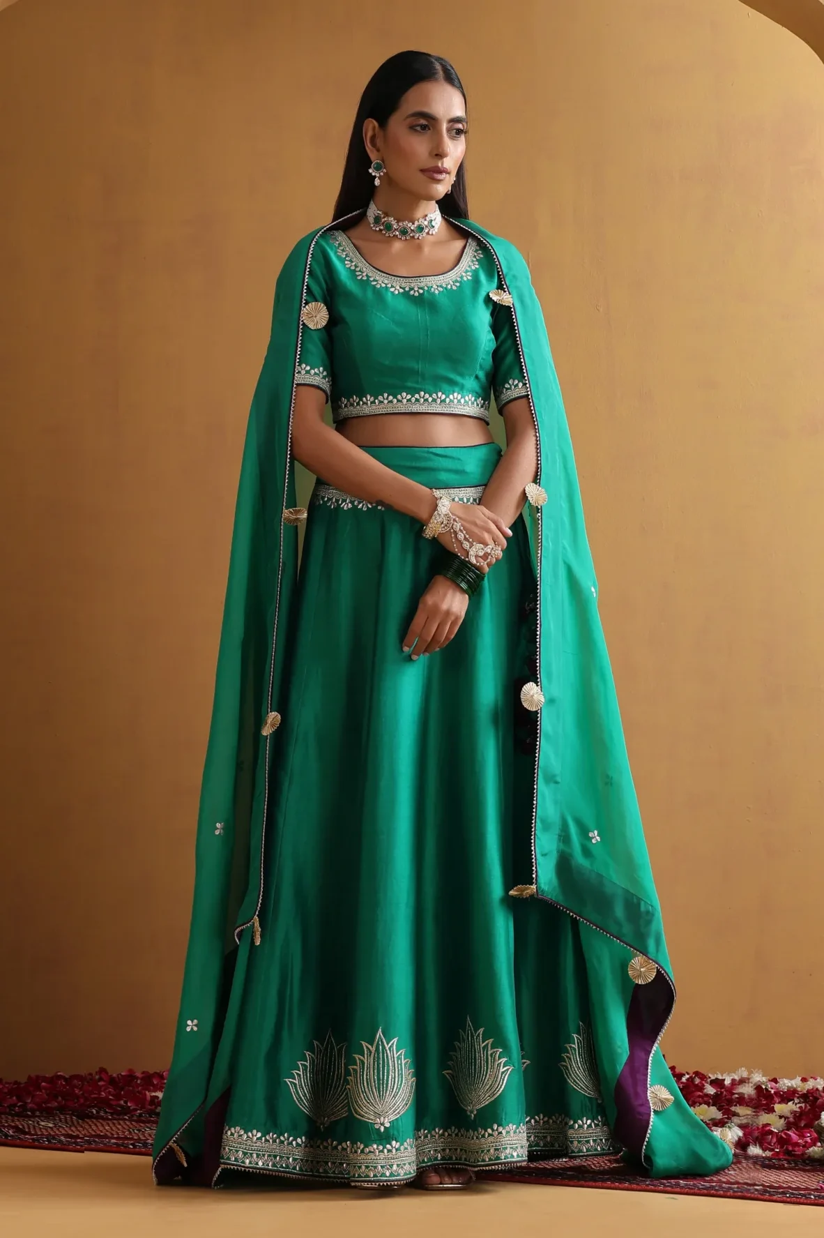 Stunning green embroidered lehenga set with net dupatta from Golden Muslin By Suikala