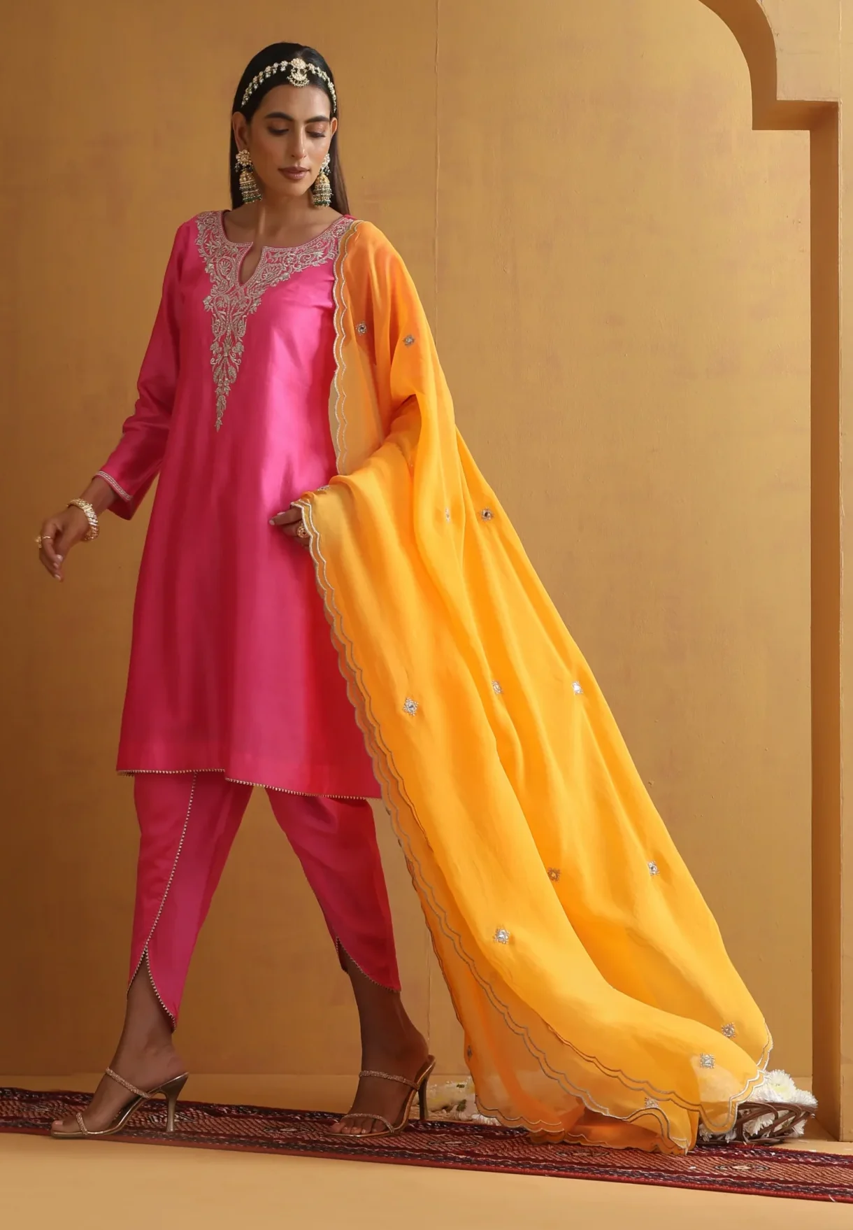 Vibrant pink embroidered ethnic suit set with contrast dupatta from Golden Muslin By Suikala