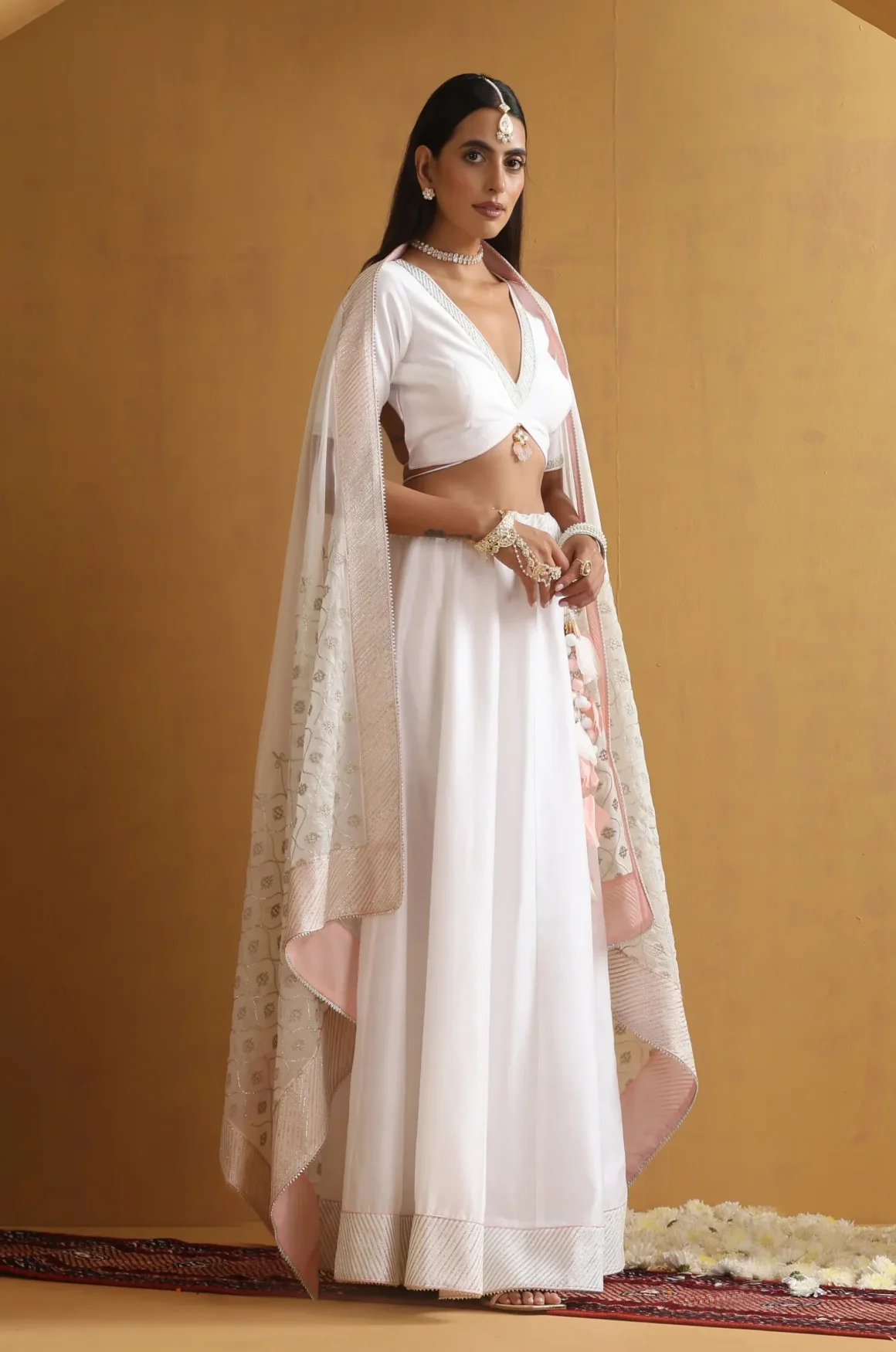 Graceful ivory saree-inspired lehenga ensemble with delicate border from Golden Muslin By Suikala