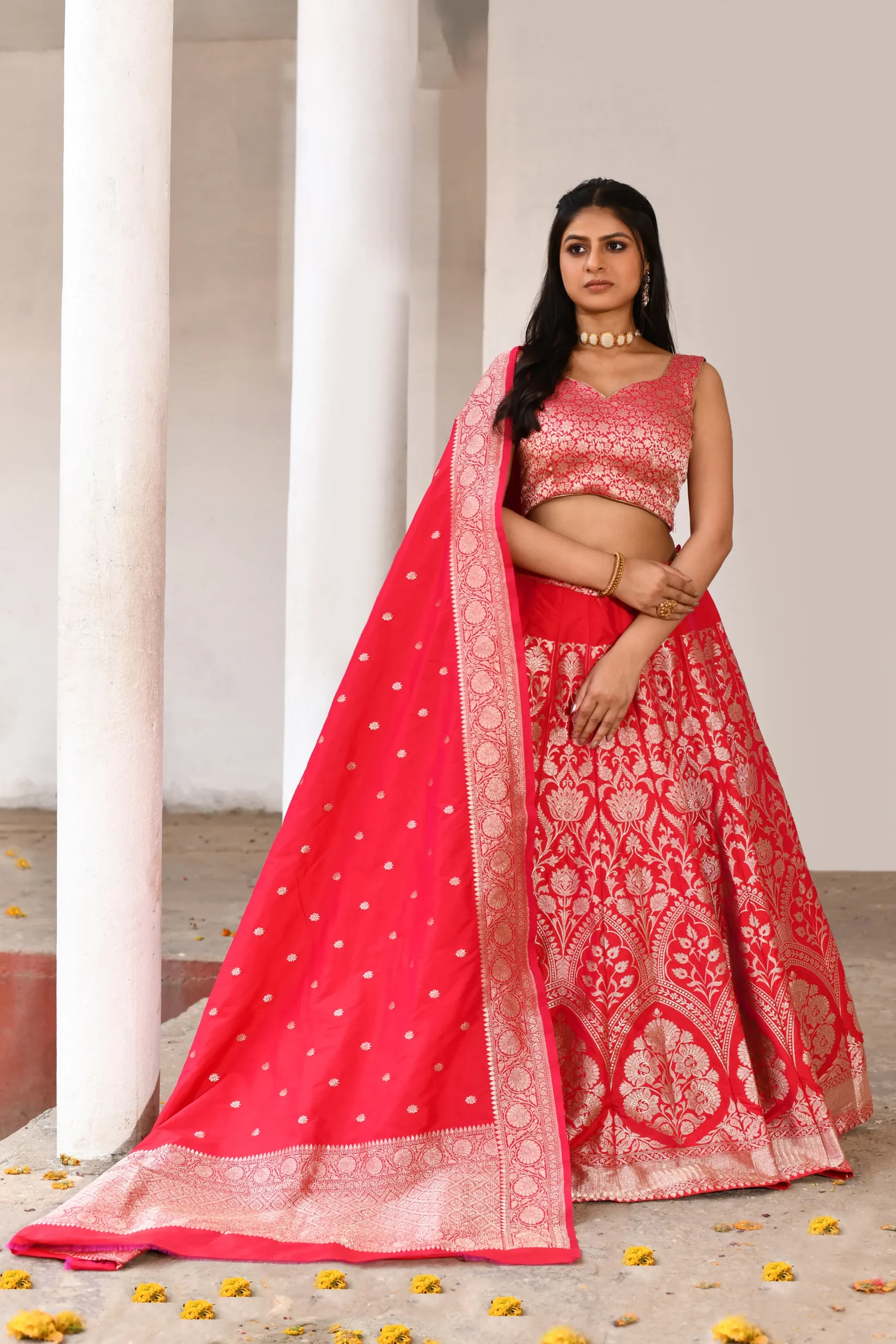 Red Banarasi soft silk lehenga handwoven with 21 kali and gold zari from Golden Muslin by Naaritva Banaras showcasing royal festive craftsmanship