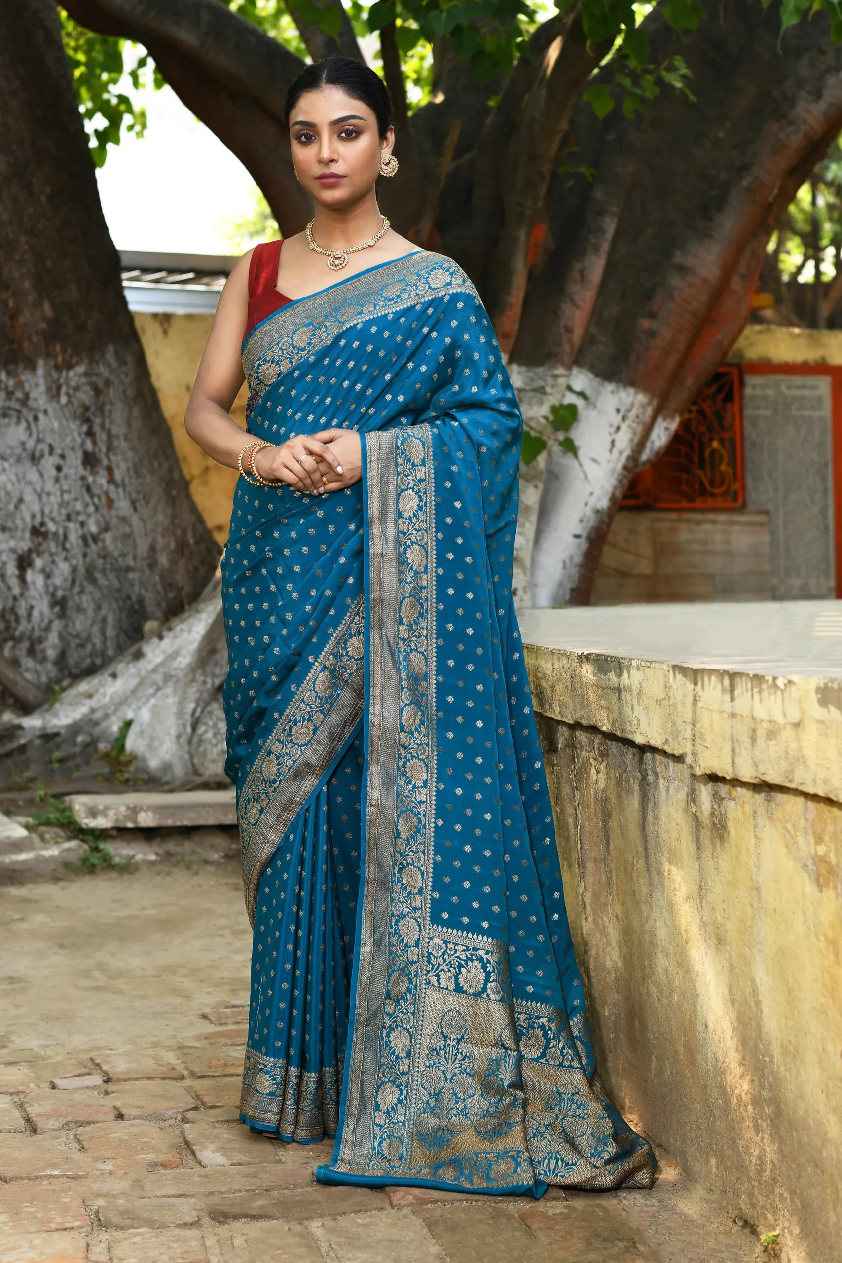 Peacock Blue Banarasi Saree with Silver Zari Floral Motifs from Golden Muslin By Naaritva Banaras