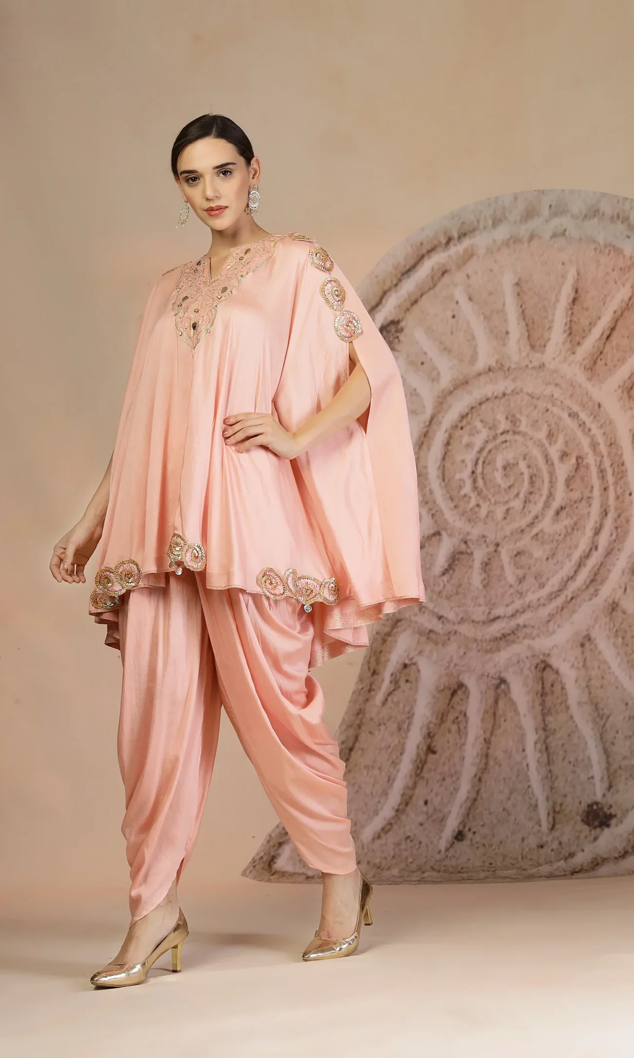 Powder pink muslin silk peplum kurta set with tulip pants and poncho drape from Golden Muslin By Soniya G