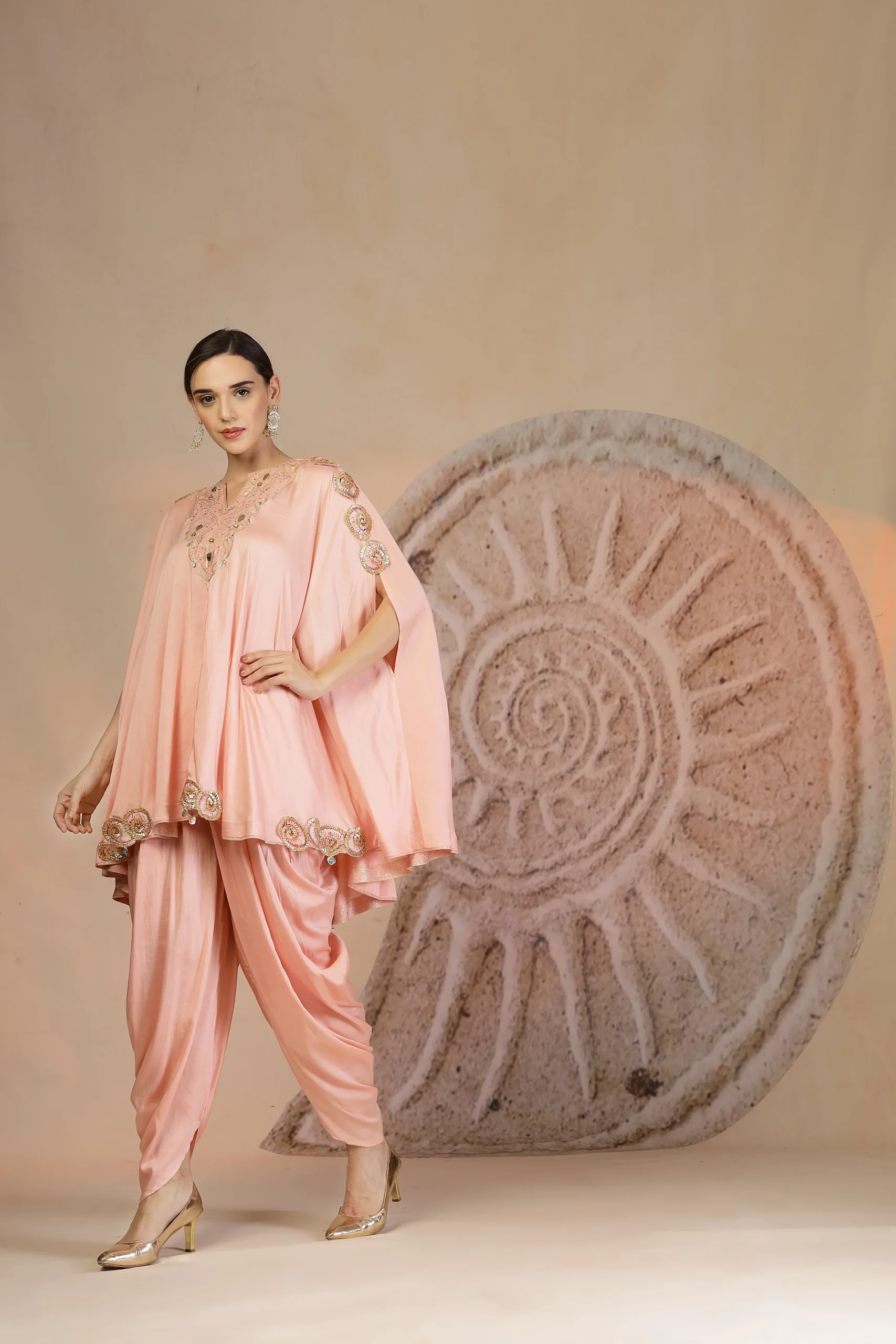Powder pink muslin silk peplum kurta set with tulip pants and poncho drape from Golden Muslin By Soniya G