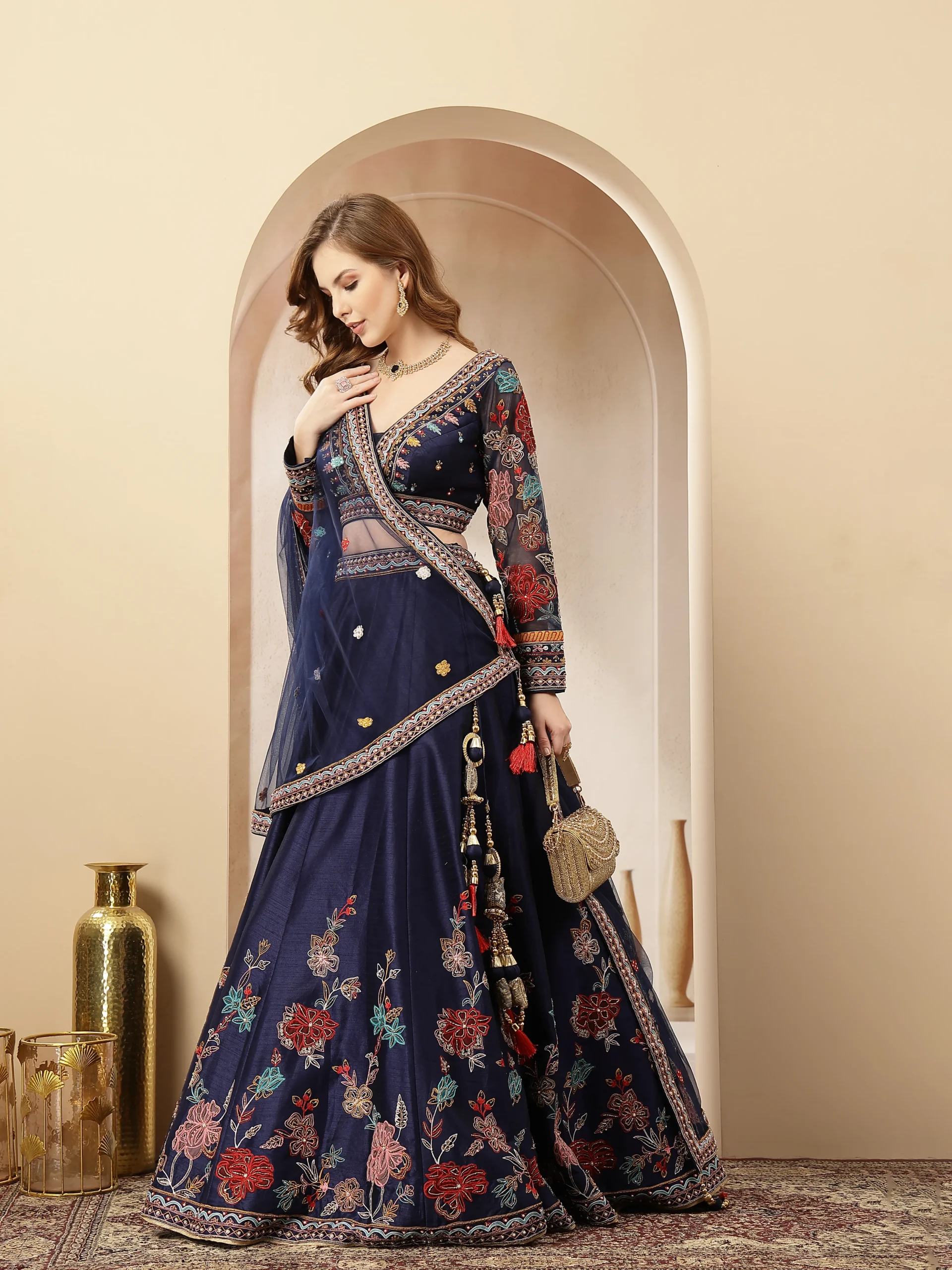 Navy blue silk embroidered lehenga with deep V-neck blouse from Golden Muslin By Soniya G