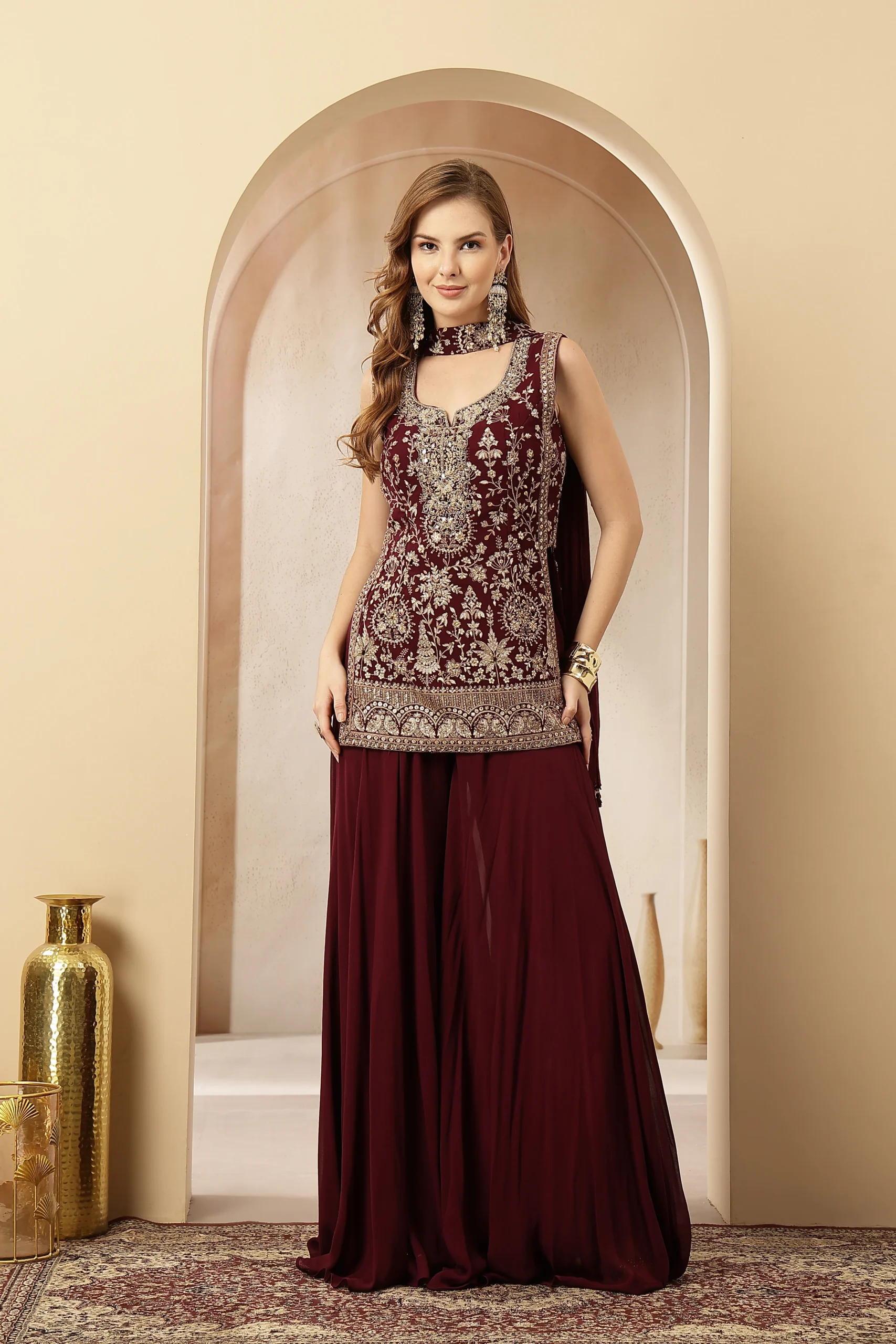 Maroon velvet embroidered sleeveless kurta with georgette palazzo pants from Golden Muslin By Soniya G