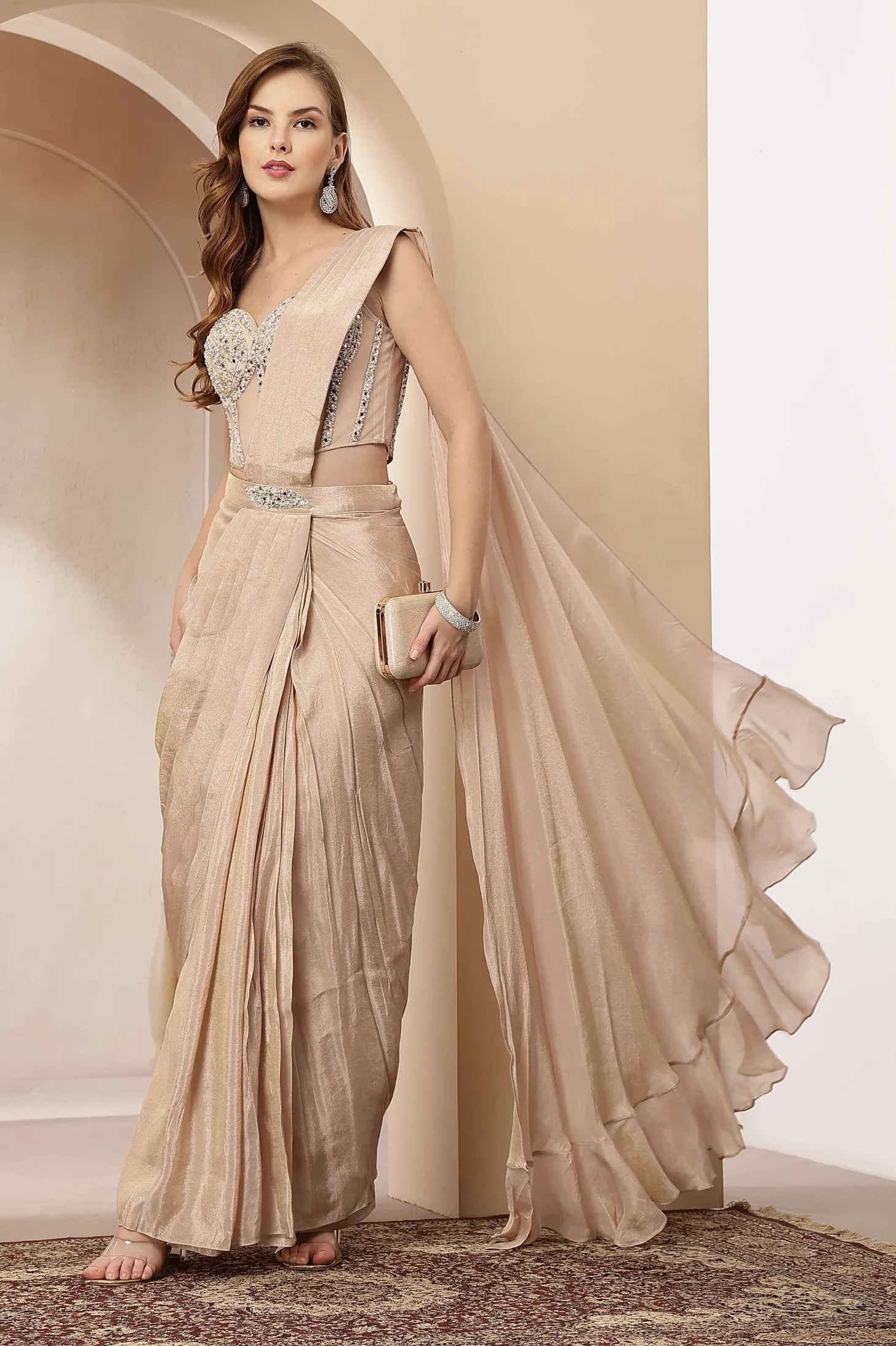 Nude beige pre draped saree gown with embellished corset from Golden Muslin By Soniya G