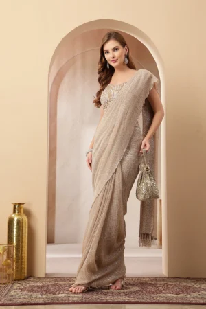 Taupe beige shimmer georgette pre-draped saree gown with embellished blouse from Golden Muslin By Soniya G