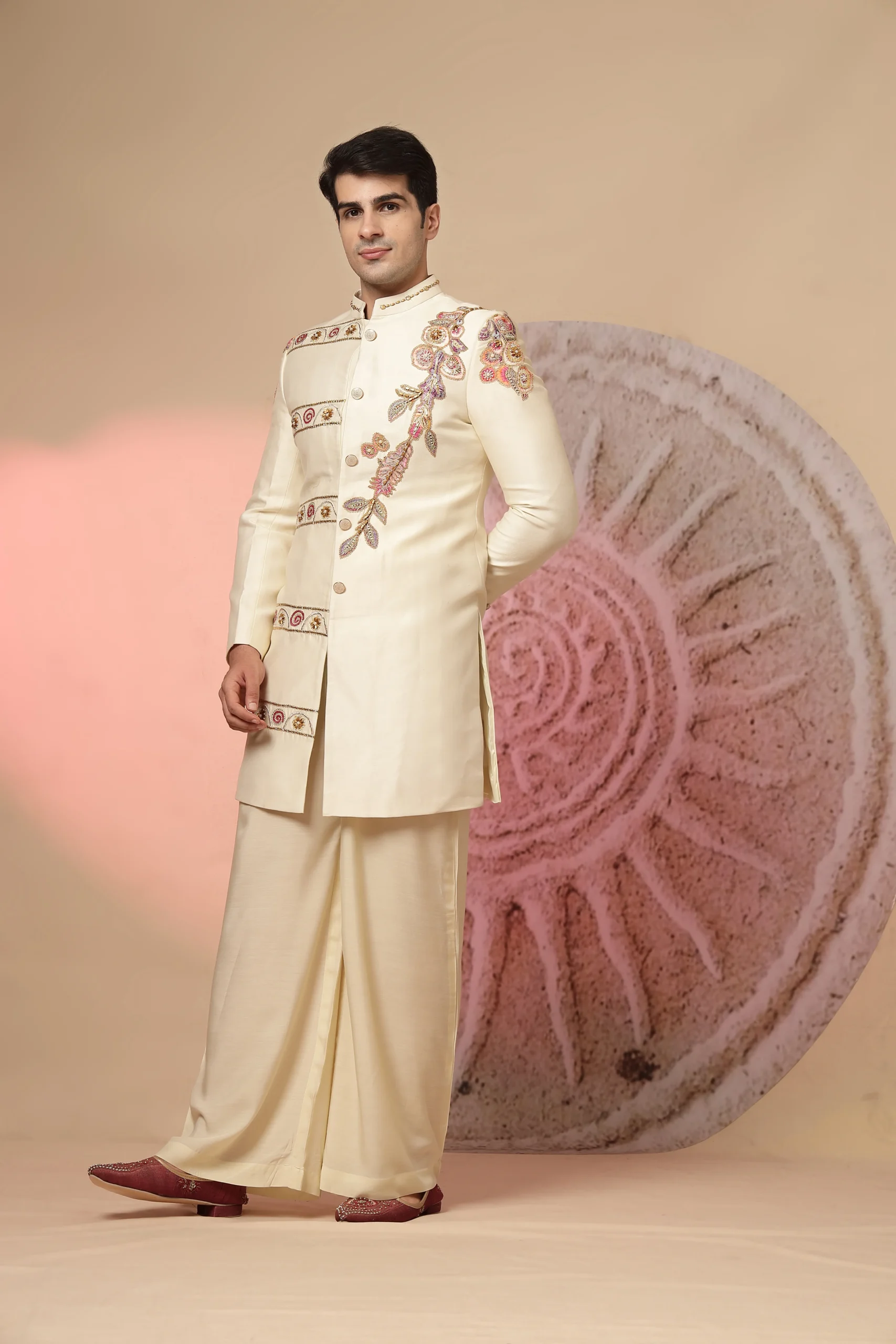 Off-white Indo-Western ensemble with embroidered tailored jacket and palazzo pants from Golden Muslin By Soniya G