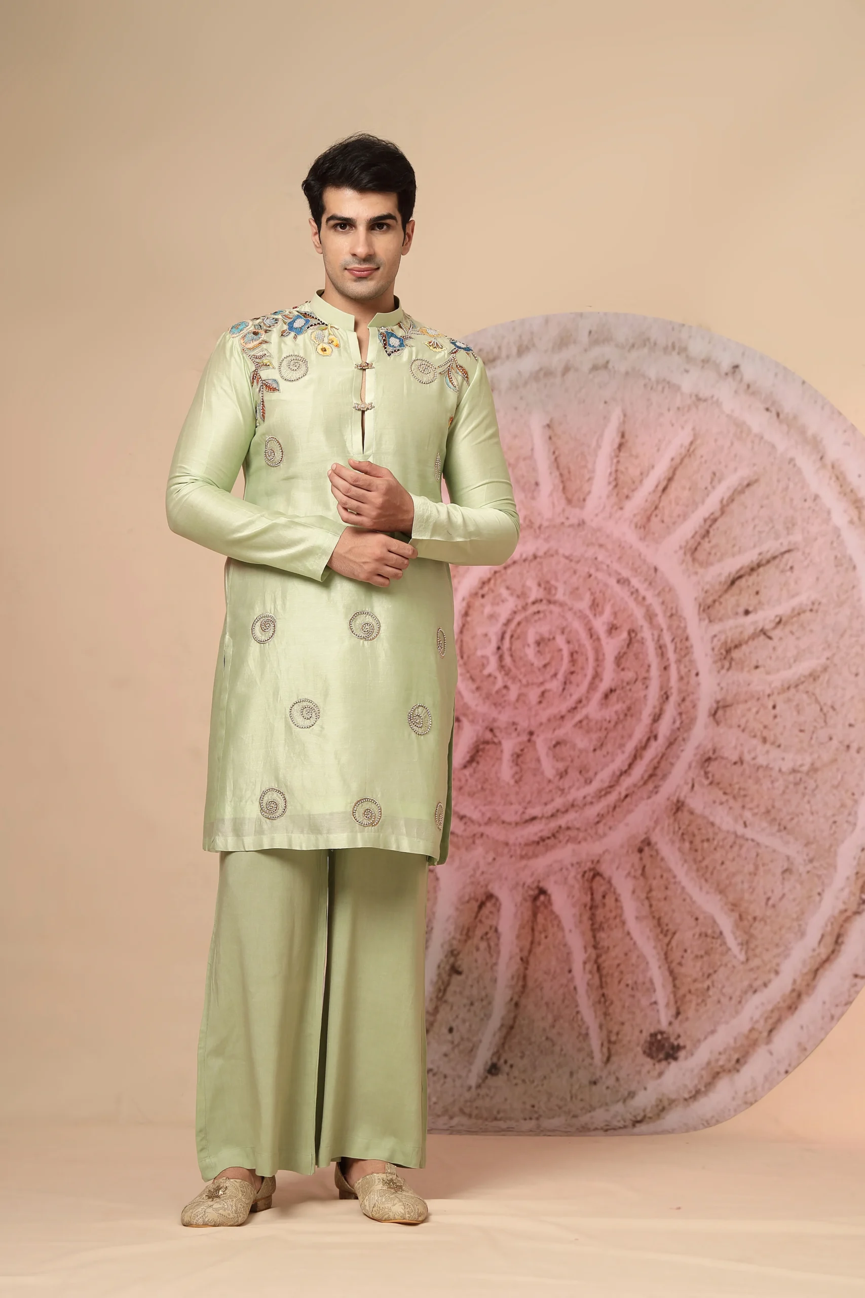 Sage green silk kurta set with mandarin collar and hand-embroidered detailing from Golden Muslin By Soniya G