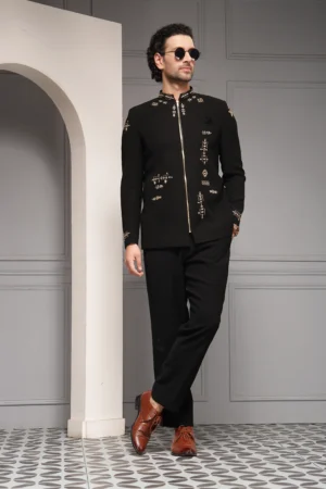 Black bandhgala ensemble with antique gold embroidery and tailored trousers from Golden Muslin By Soniya G