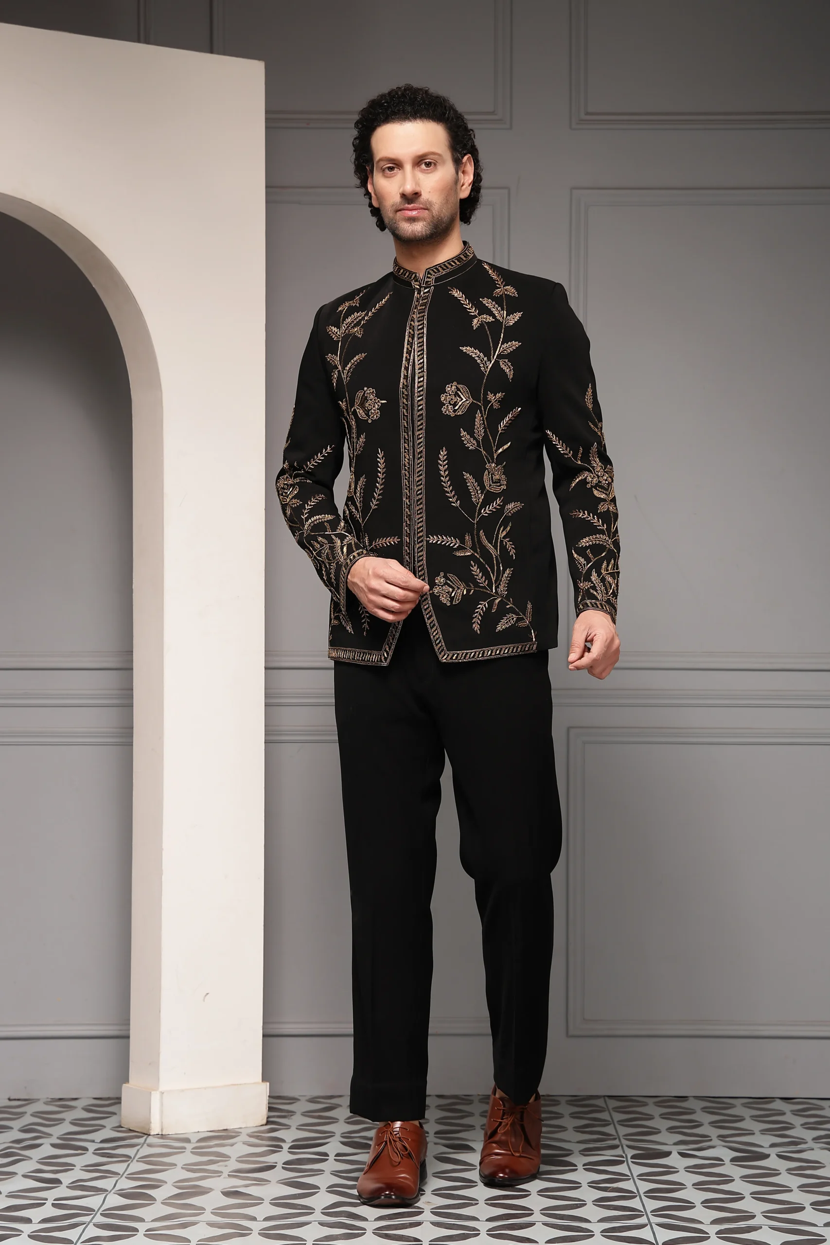 Regal black bandhgala set with antique gold floral embroidery from Golden Muslin By Soniya G