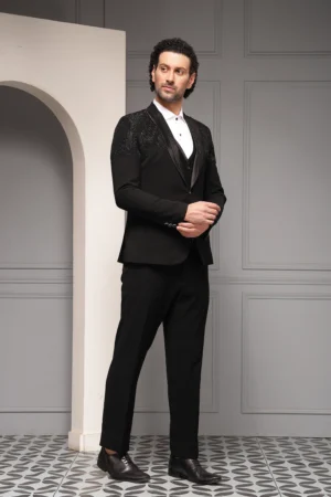 Black three piece tuxedo set with satin lapel from Golden Muslin By Soniya G