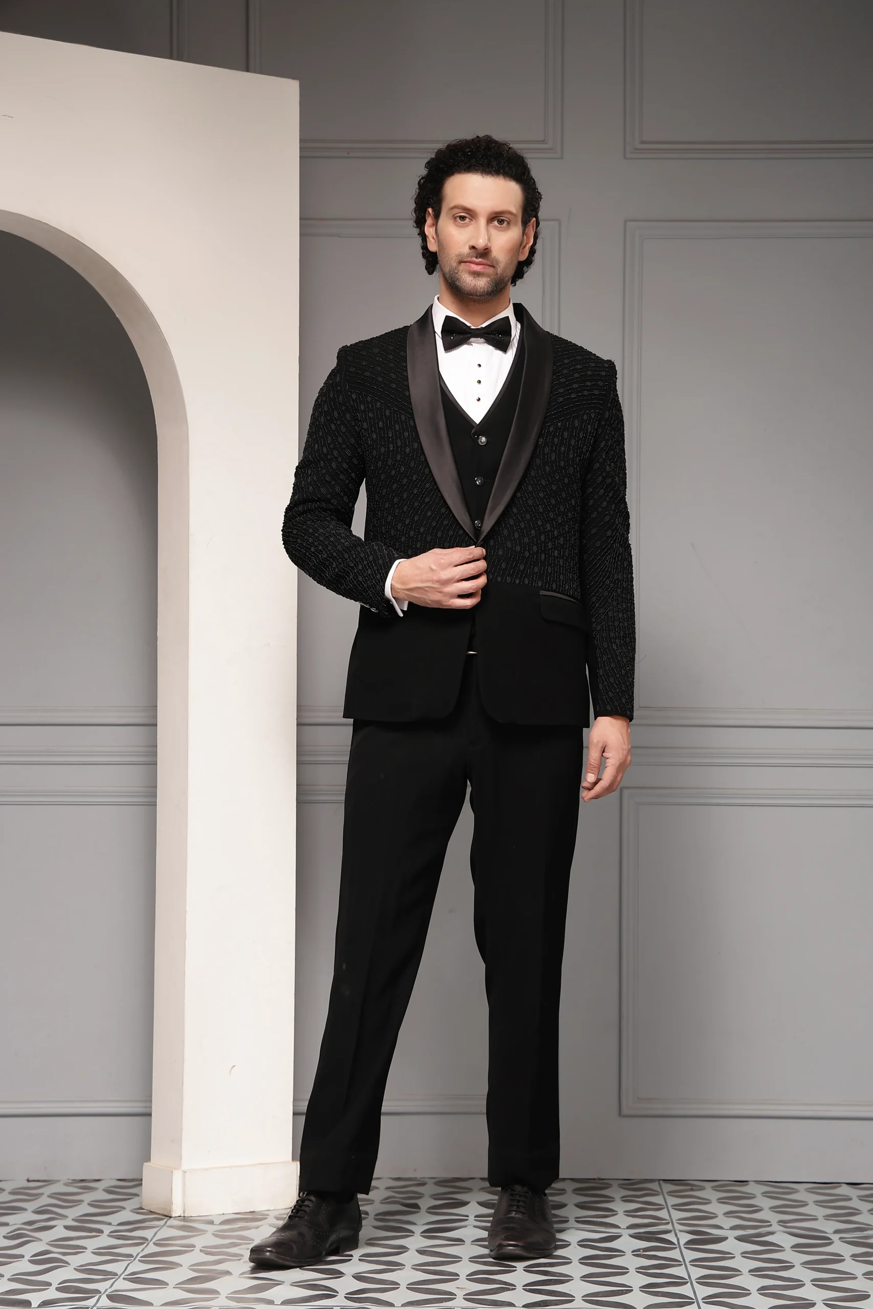 Black three-piece tuxedo set with satin finish blazer from Golden Muslin By Soniya G