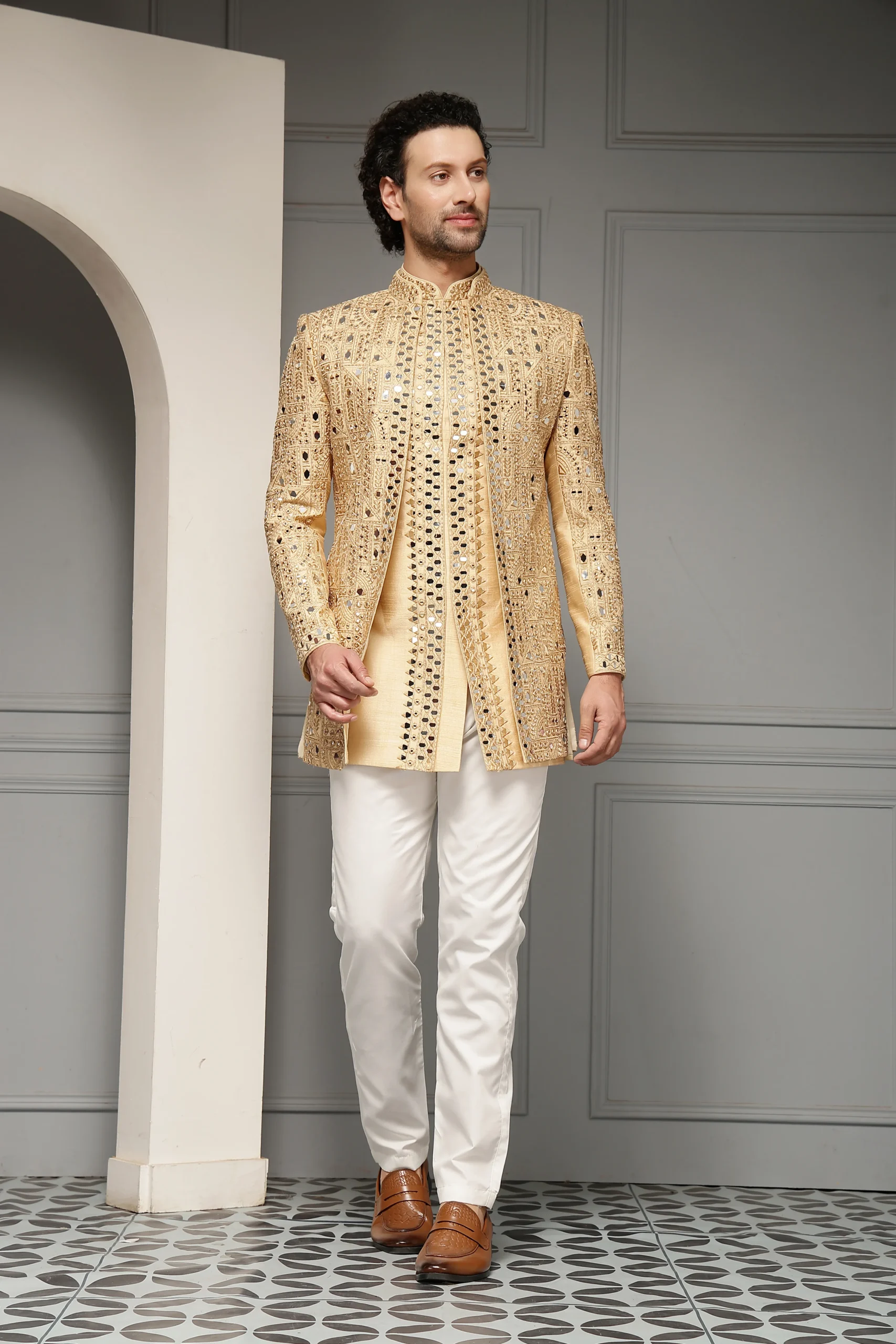 Gold Silk Jacquard Sherwani Style Bandhgala Set from Golden Muslin By Soniya G with antique zari jaali embroidery and tailored trousers
