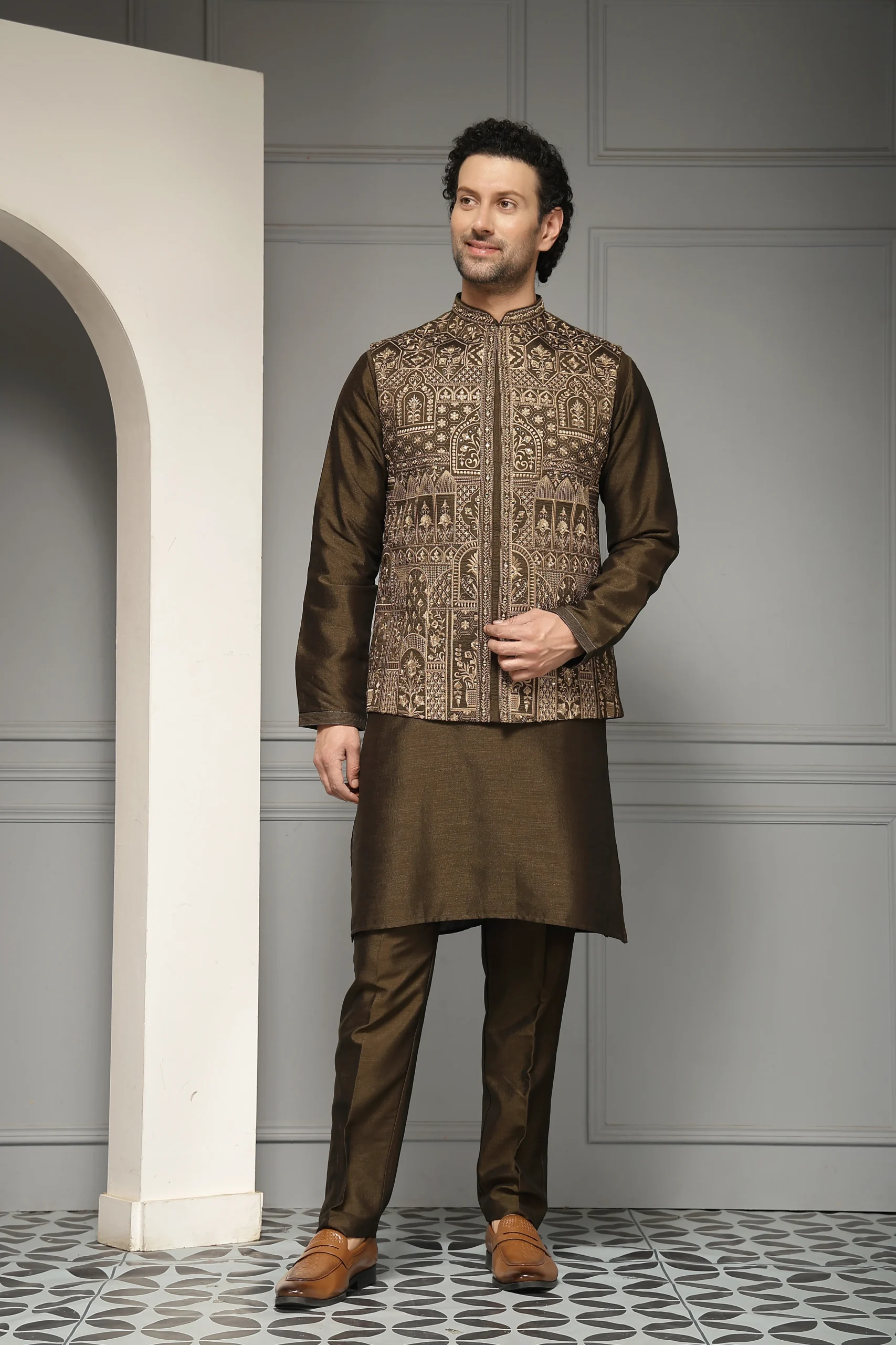 Deep olive silk kurta set with antique gold embroidered Nehru jacket from Golden Muslin By Soniya G