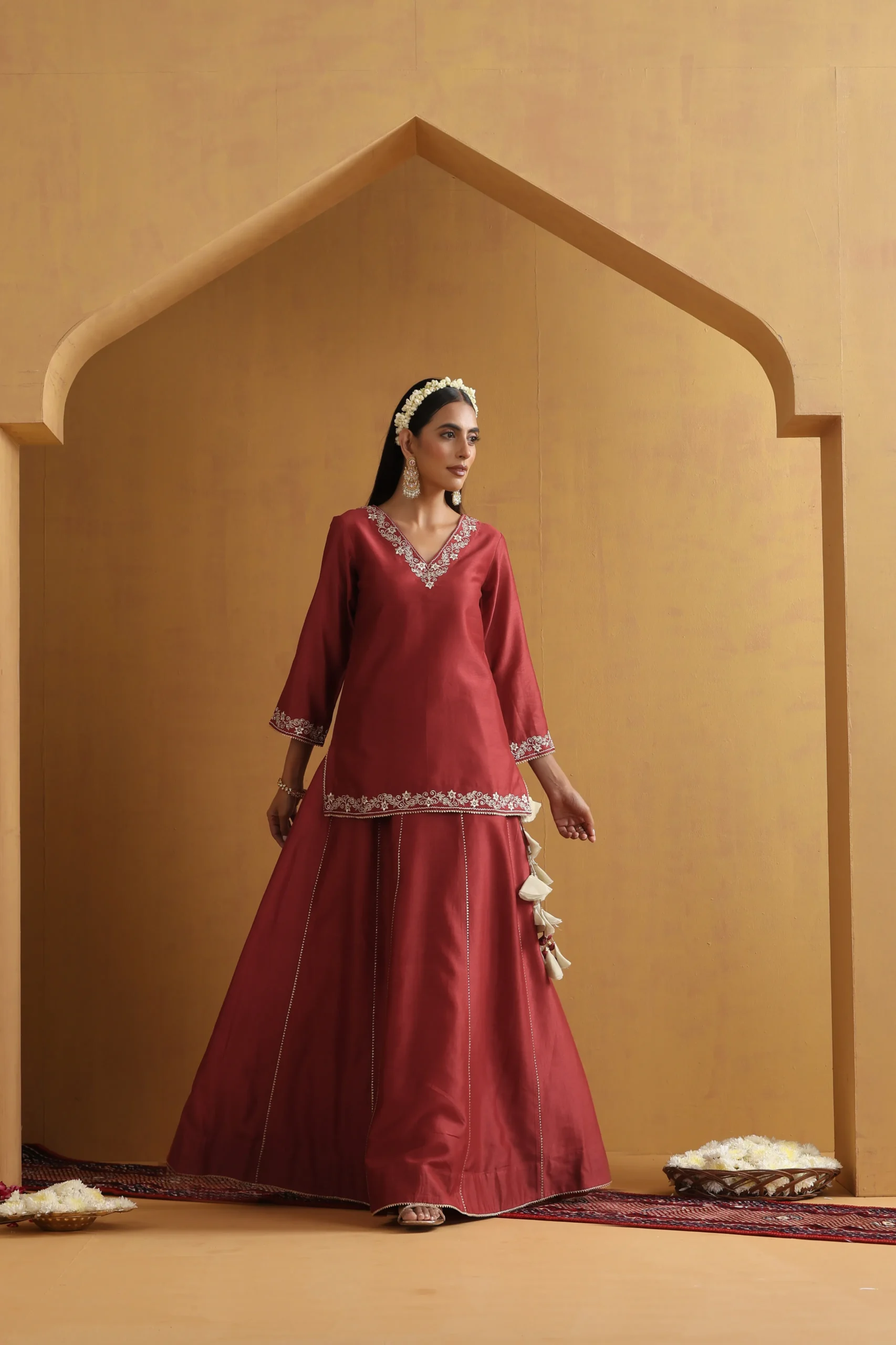 Rust embroidered lehenga set with silver floral detailing from Golden Muslin By Suikala