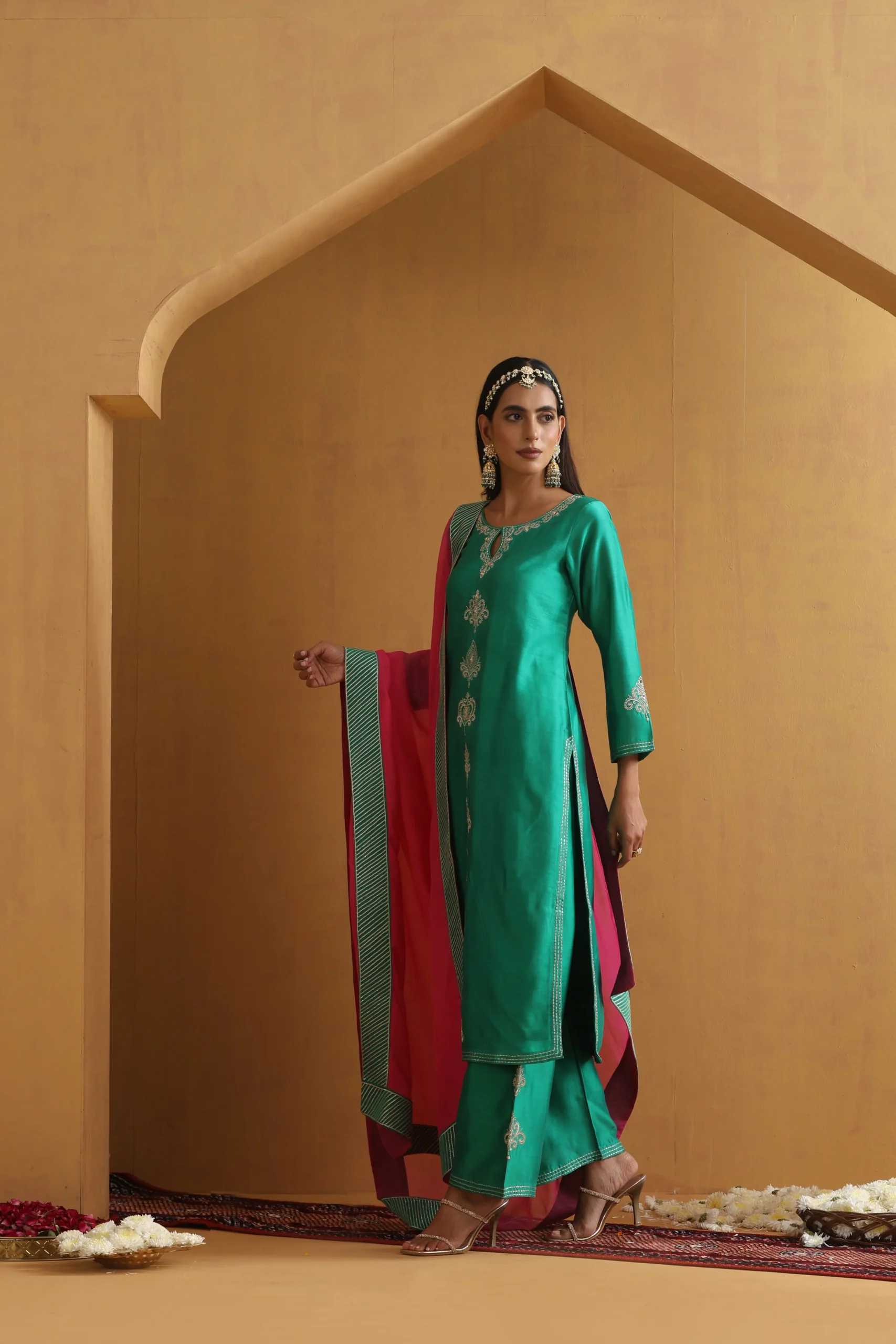 Vibrant teal green embroidered ethnic suit set with contrast dupatta from Golden Muslin By Suikala