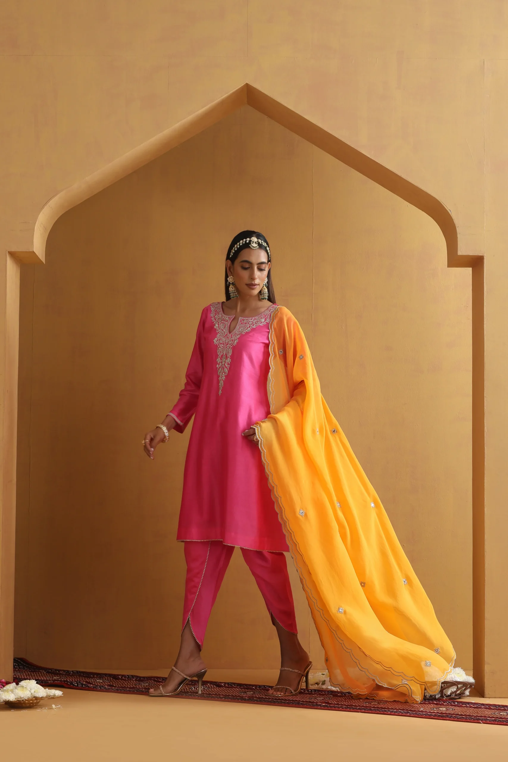 Vibrant pink embroidered ethnic suit set with contrast dupatta from Golden Muslin By Suikala