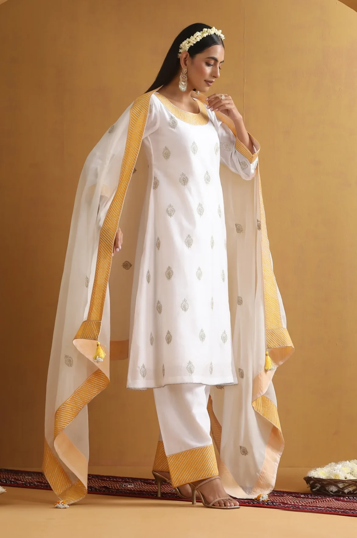 Ethereal white embroidered ethnic suit set with golden borders from Golden Muslin By Suikala