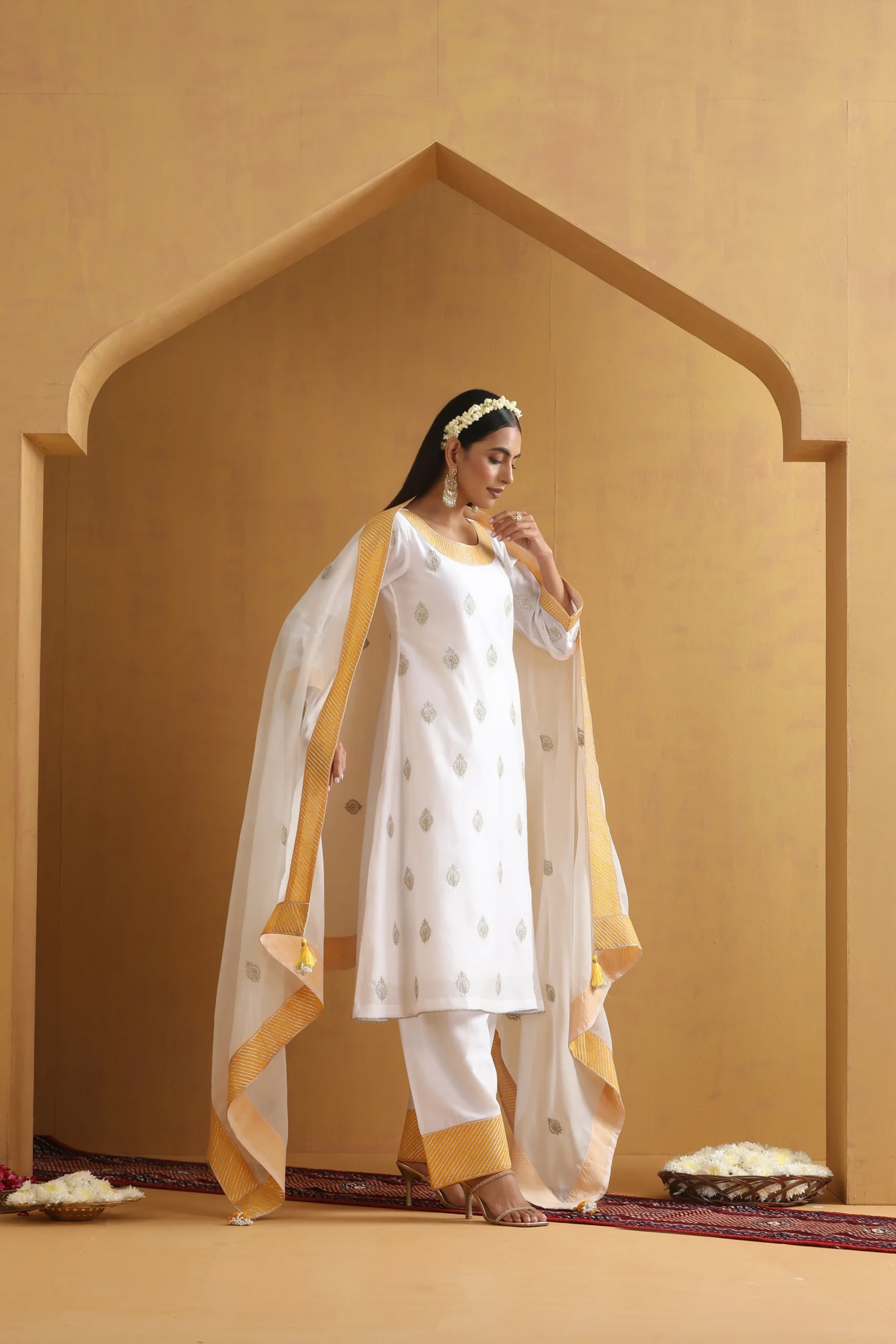 Ethereal white embroidered ethnic suit set with golden borders from Golden Muslin By Suikala