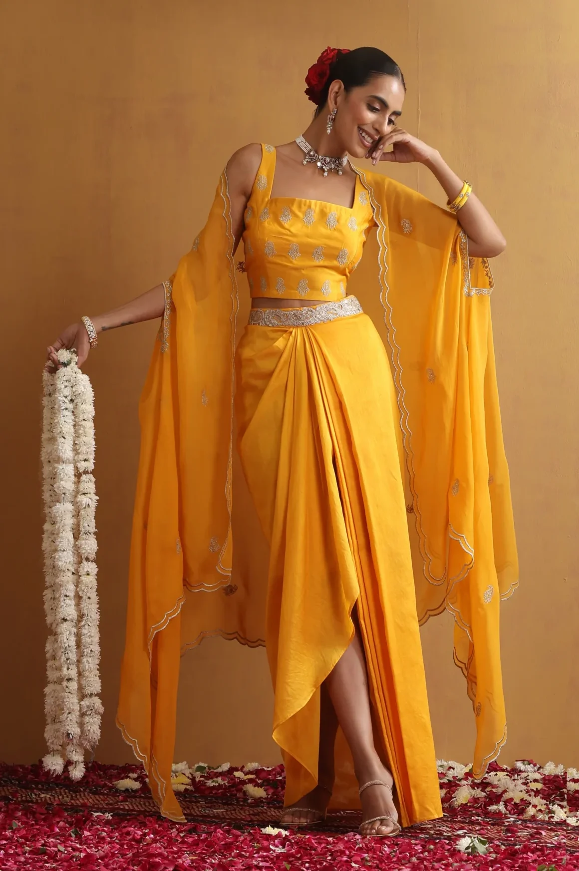 Radiant yellow draped embroidered ensemble with cape sleeves from Golden Muslin By Suikala