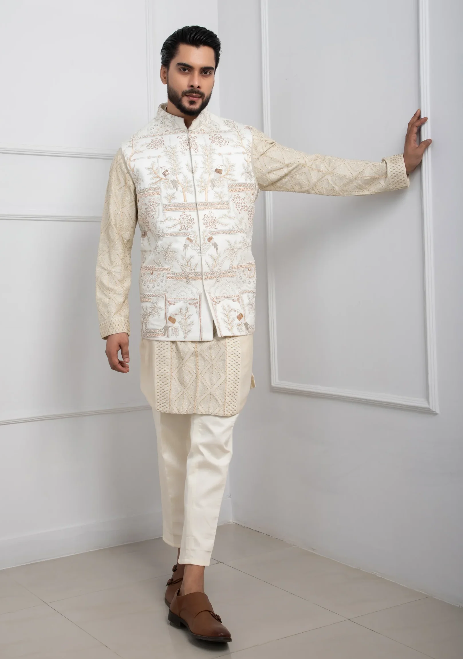 Ivory kurta set with embroidered Nehru jacket by Golden Muslin featuring slim-fit trousers and mandarin collar