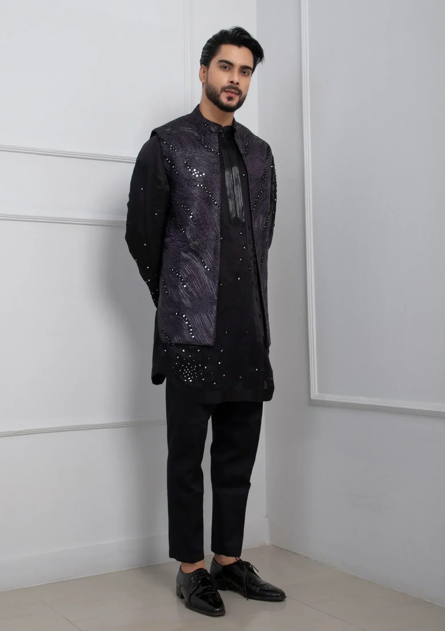 Model wearing dark purple golden muslin Nehru jacket with zipper kurta set and black pants