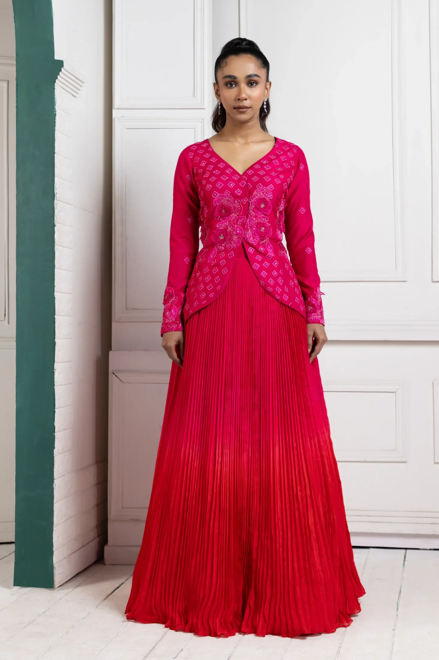 Hot pink embroidered lehenga set with pleated skirt and V neckline from Golden Muslin By Anuj Agarwal