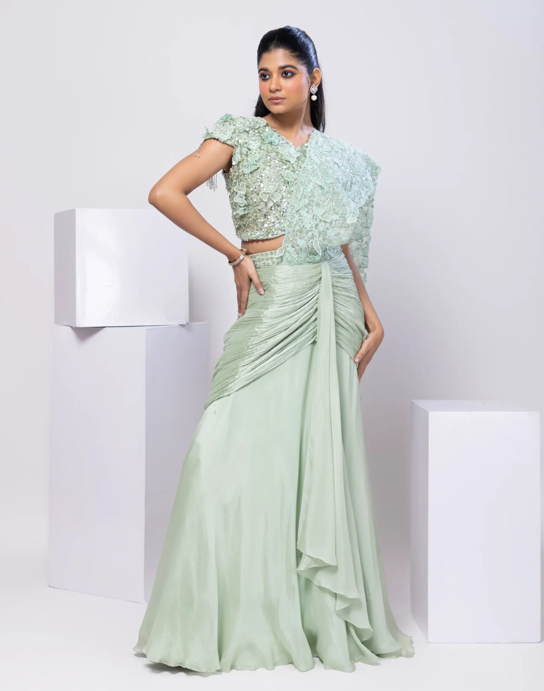 Golden Muslin Light Pista Crystal Embellished Drape Saree Gown with lace appliqué and pleated skirt