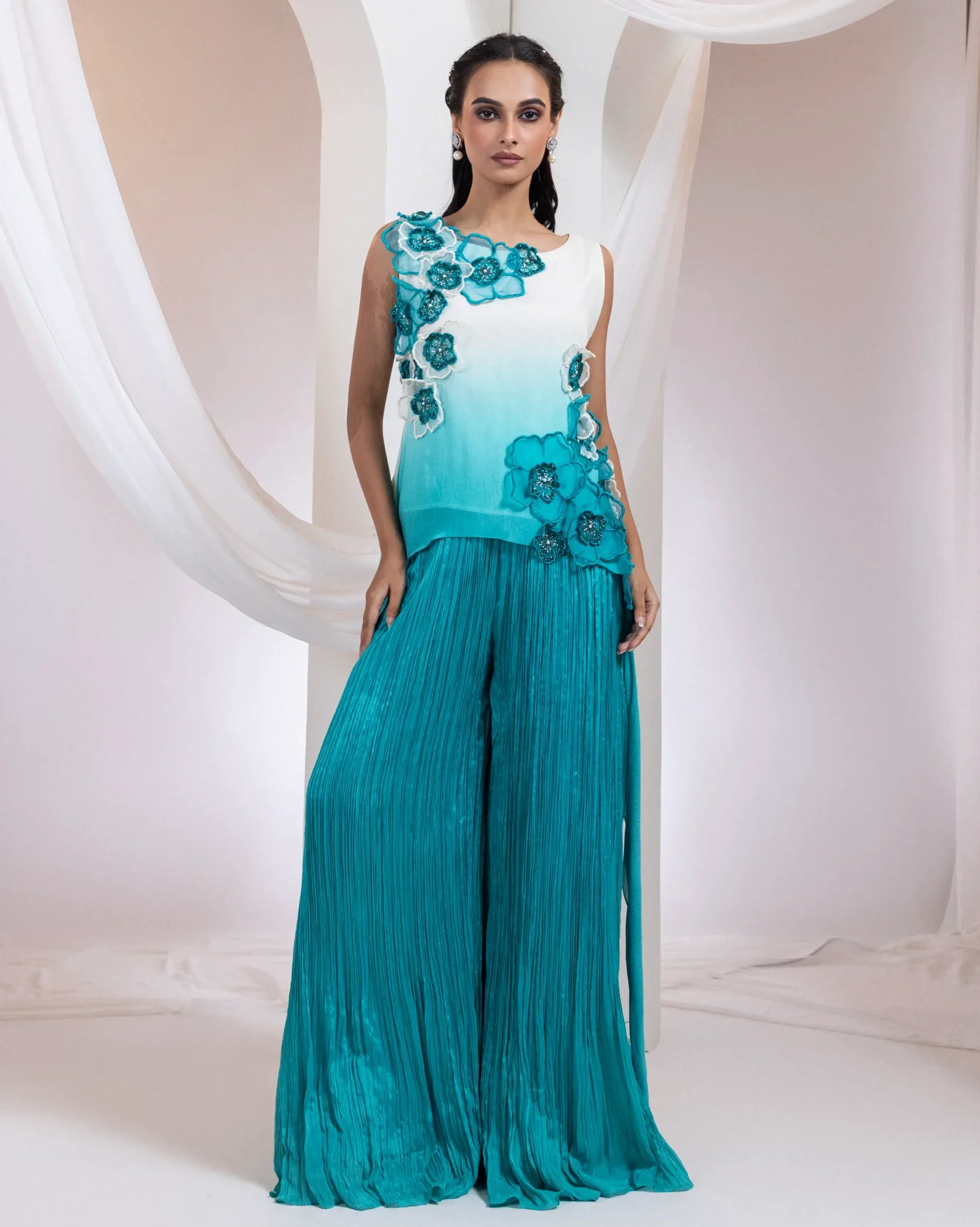 Ivory to aqua ombre top with 3D floral appliqué and palazzo pants from Golden Muslin By Anuj Agarwal