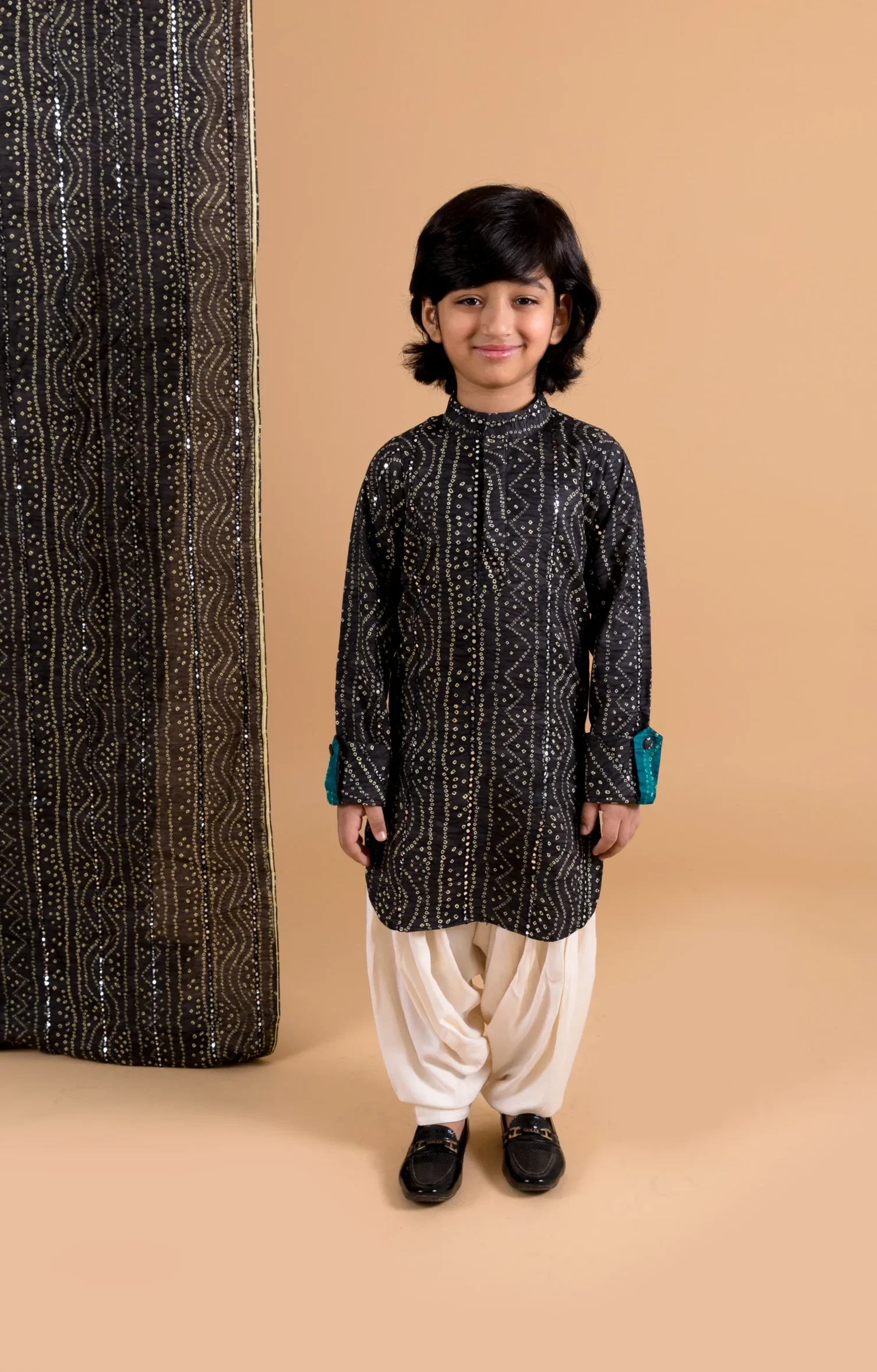 Black Bandhani Pathani Kurta Salwar Set with mirror detailing from Golden Muslin By Choti Buti
