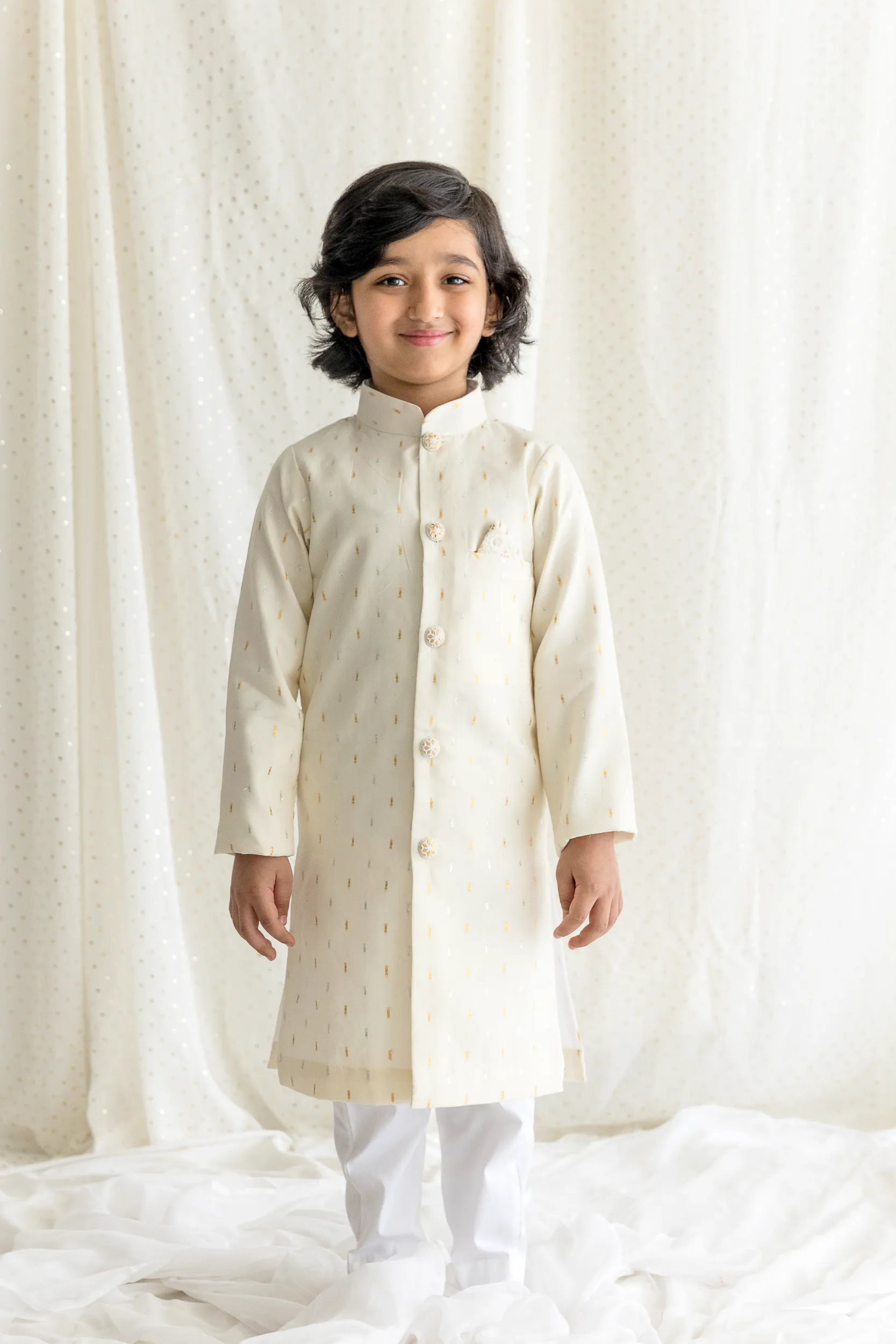 Off White Sherwani with gold and silver thread embroidery paired with cotton lycra pants from Golden Muslin By Choti Buti