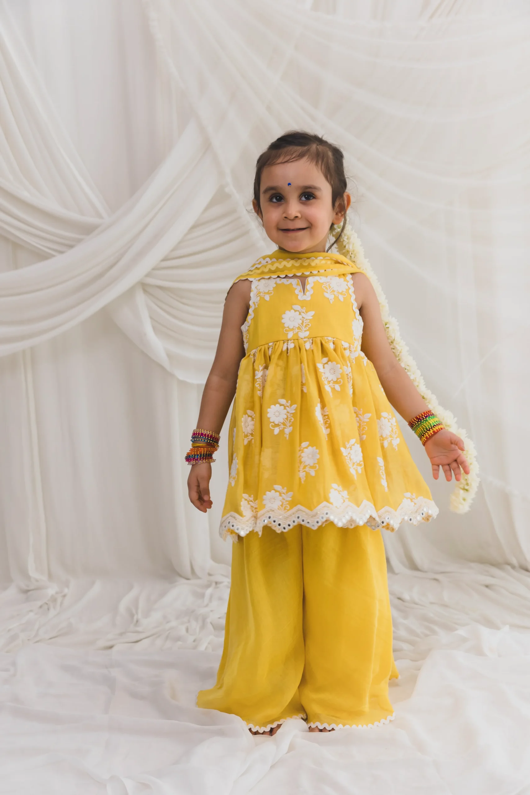 Yellow Mul Chanderi Sharara Set with embroidered kurta and dupatta from Golden Muslin By Choti Buti
