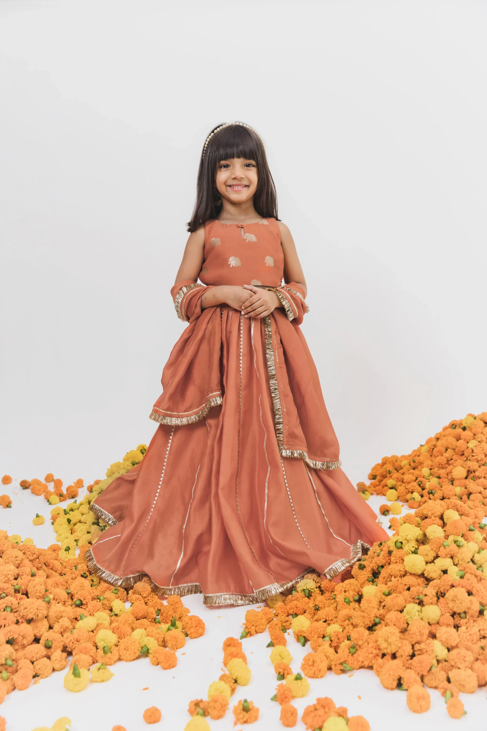 Orange Chanderi Lehenga Set with embroidered choli and dupatta from Golden Muslin By Choti Buti