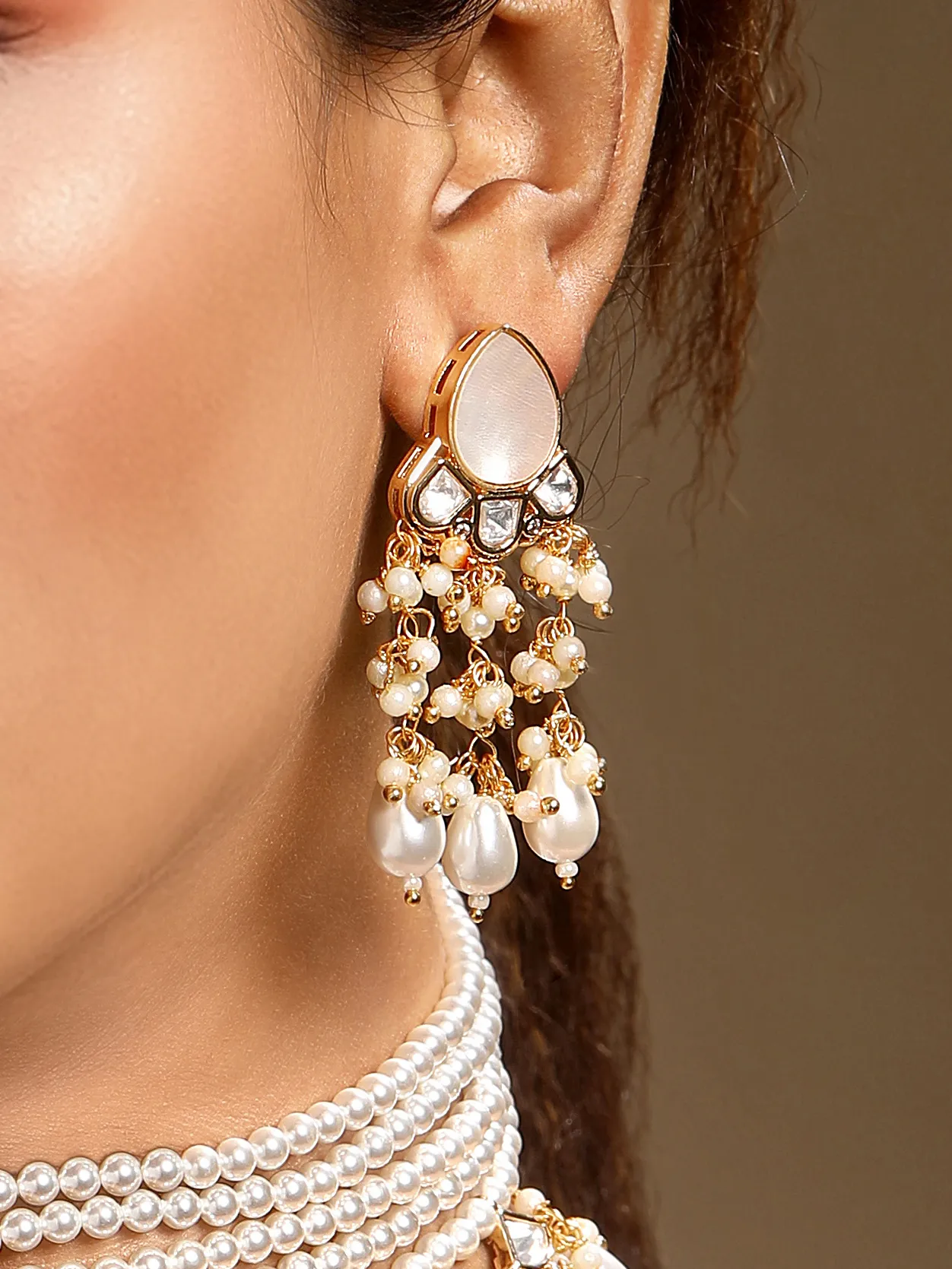 Cream gold shell pearl mother of pearl Kundan Polki dangler earrings from Golden Muslin By Hrisha
