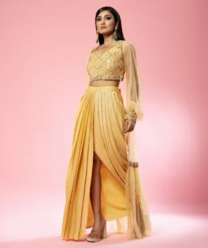 Golden Co-ord Set with modal satin blouse, dhoti and embroidered net cape from Golden Muslin By Quench A Thirst