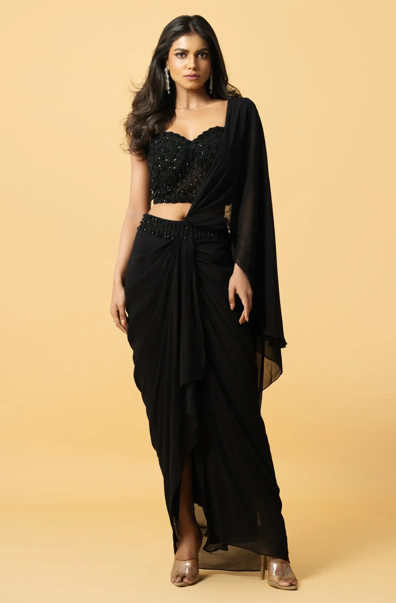 Black Georgette Pre-Stitched Saree with hand-embroidered corset blouse featuring zardosi cutdana tiki and crystal work from Golden Muslin By Quench A Thirst