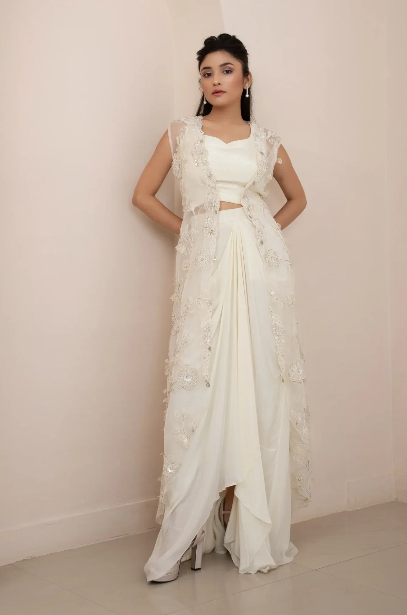 Ivory Wildflower Jacket and Drape Skirt Set with Pearl Embellished Blouse and 3D Floral Organza Jacket from Golden Muslin By Anuj Agarwal