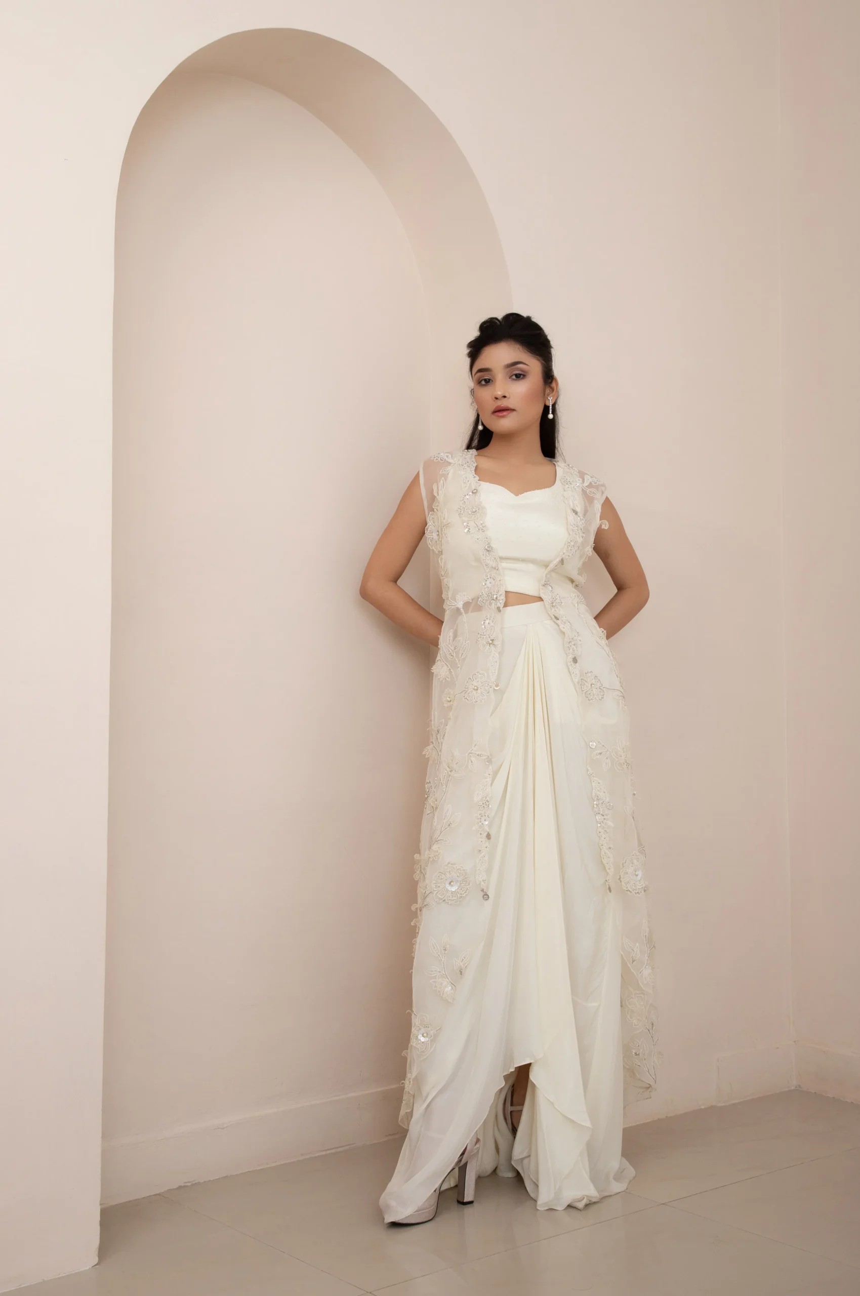 Ivory Wildflower Jacket and Drape Skirt Set with Pearl Embellished Blouse and 3D Floral Organza Jacket from Golden Muslin By Anuj Agarwal