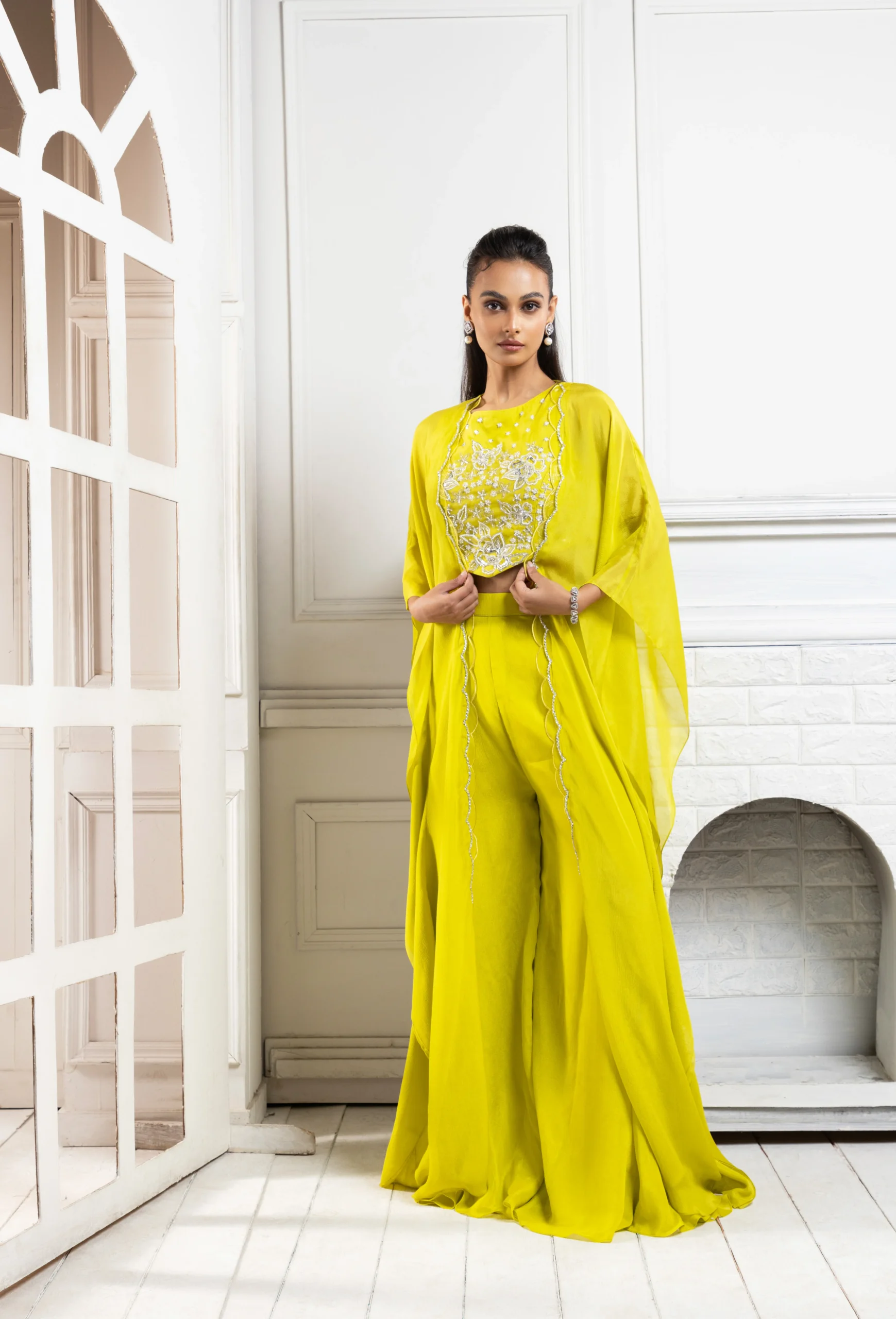 Chartreuse green embroidered cape palazzo set with crop top and flowing palazzo pants from Golden Muslin By Anuj Agarwal