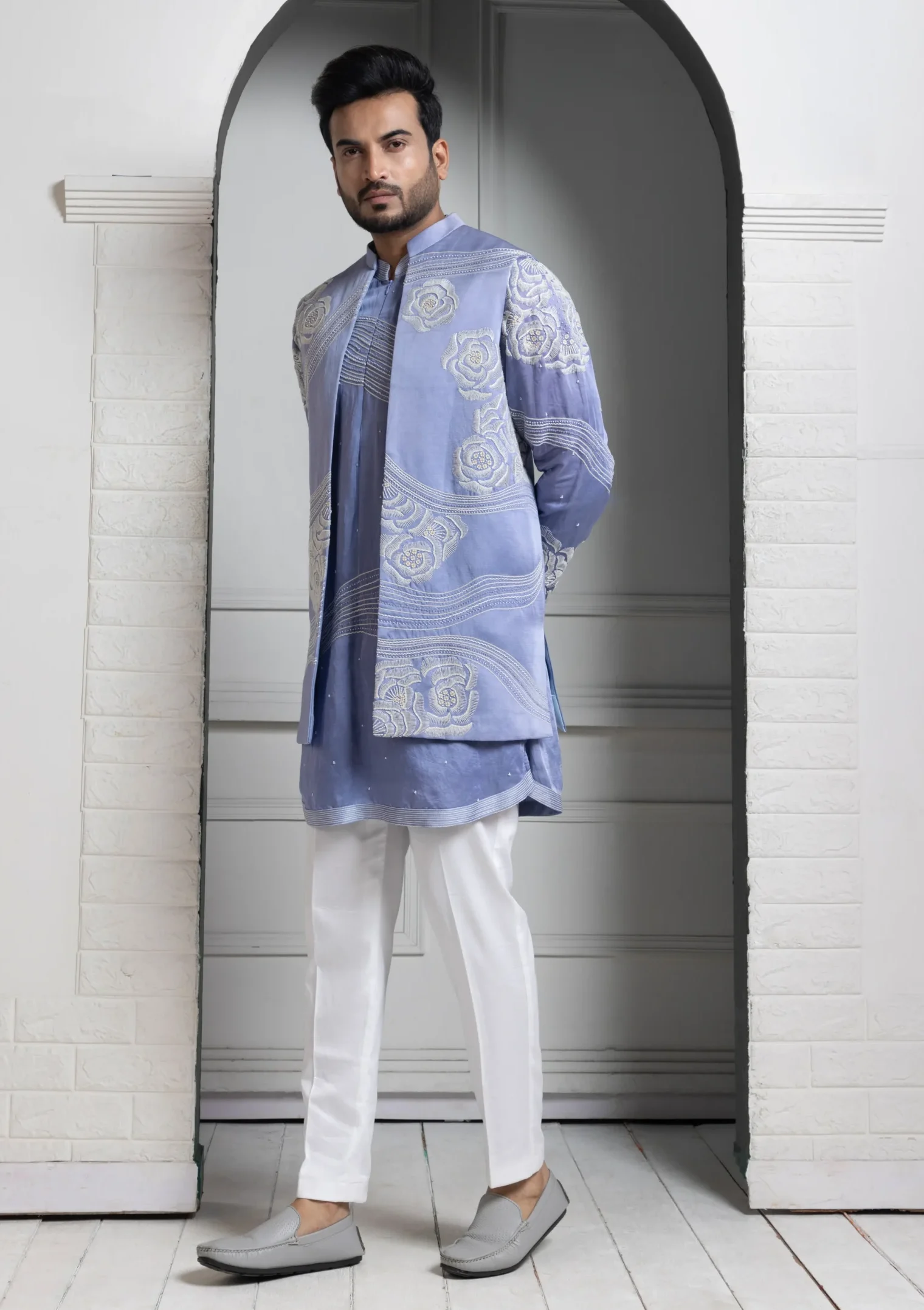 Golden Muslin Pastel Blue Embroidered Silk Kurta Ensemble with ivory waistcoat and white slim-fit trousers