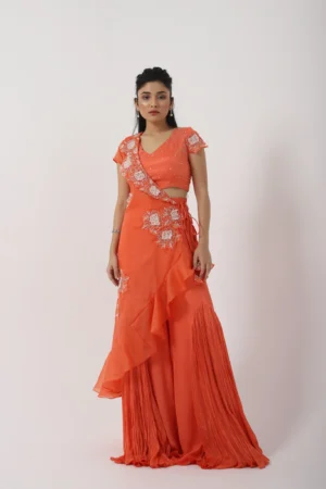Orange Sharara Set with Ruffled Drape and Floral Applique from Golden Muslin By Anuj Agarwal